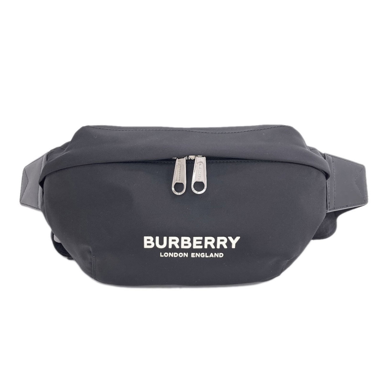 Women's Burberry Nylon Bum Bag: Women's Burberry Nylon Bum Bag A chic and practical addition to any outfit, this Burberry Nylon Bum Bag is a timeless piece that exudes classic British style. With its durable nylon material and sleek