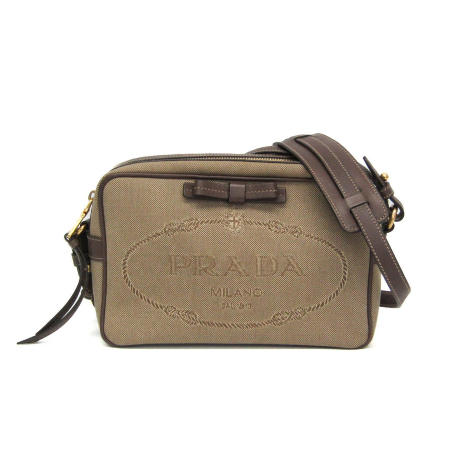 Prada Jacquard Leather Shoulder Bag: Prada Jacquard Leather Shoulder Bag Elevate your everyday style with the timeless Prada Jacquard Leather Shoulder Bag, boasting a chic beige and brown color combination that adds sophistication to any