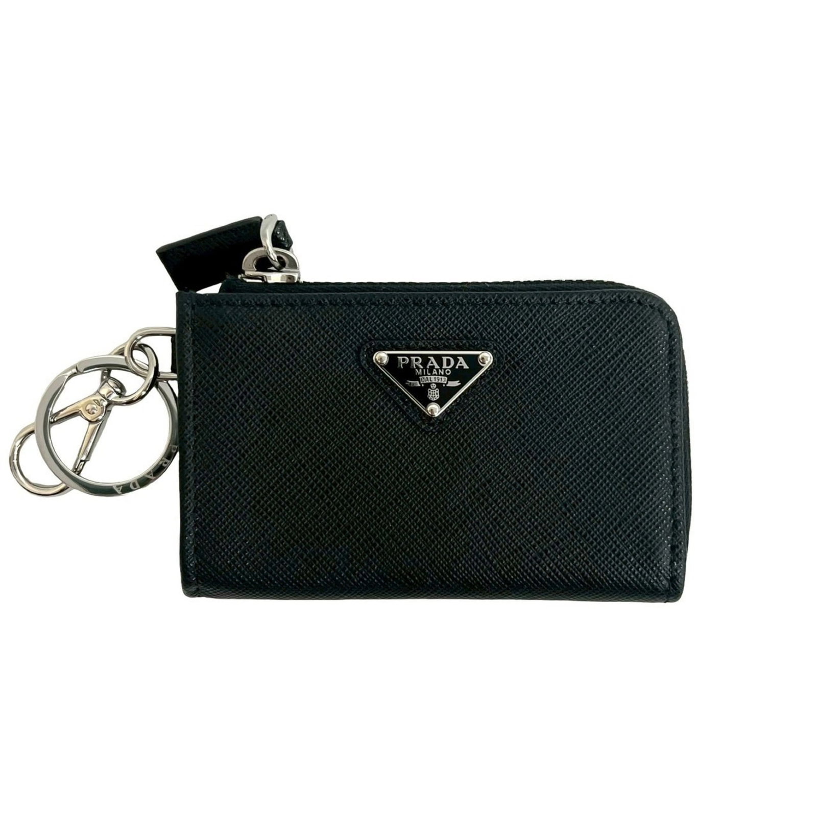 Prada Coin Purse in Leather: Prada Coin Purse in Leather A sleek and sophisticated accessory, this Prada leather coin purse is a stylish addition to any woman's wallet. Made from high-quality black leather, its compact size (6.5c