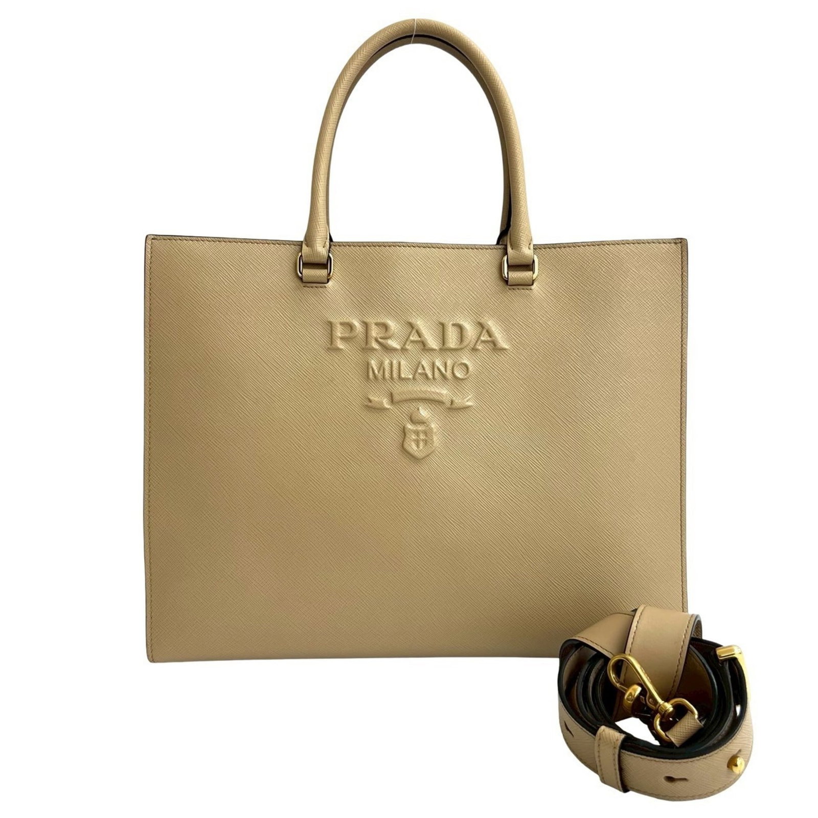 Tote Bag Leather - Prada Handbag - Shoulder Bag: Tote Bag Leather - Prada Handbag - Shoulder Bag A pre-owned Prada tote bag in beautiful beige leather, boasting the iconic Italian brand's signature style and craftsmanship. With its classic design an