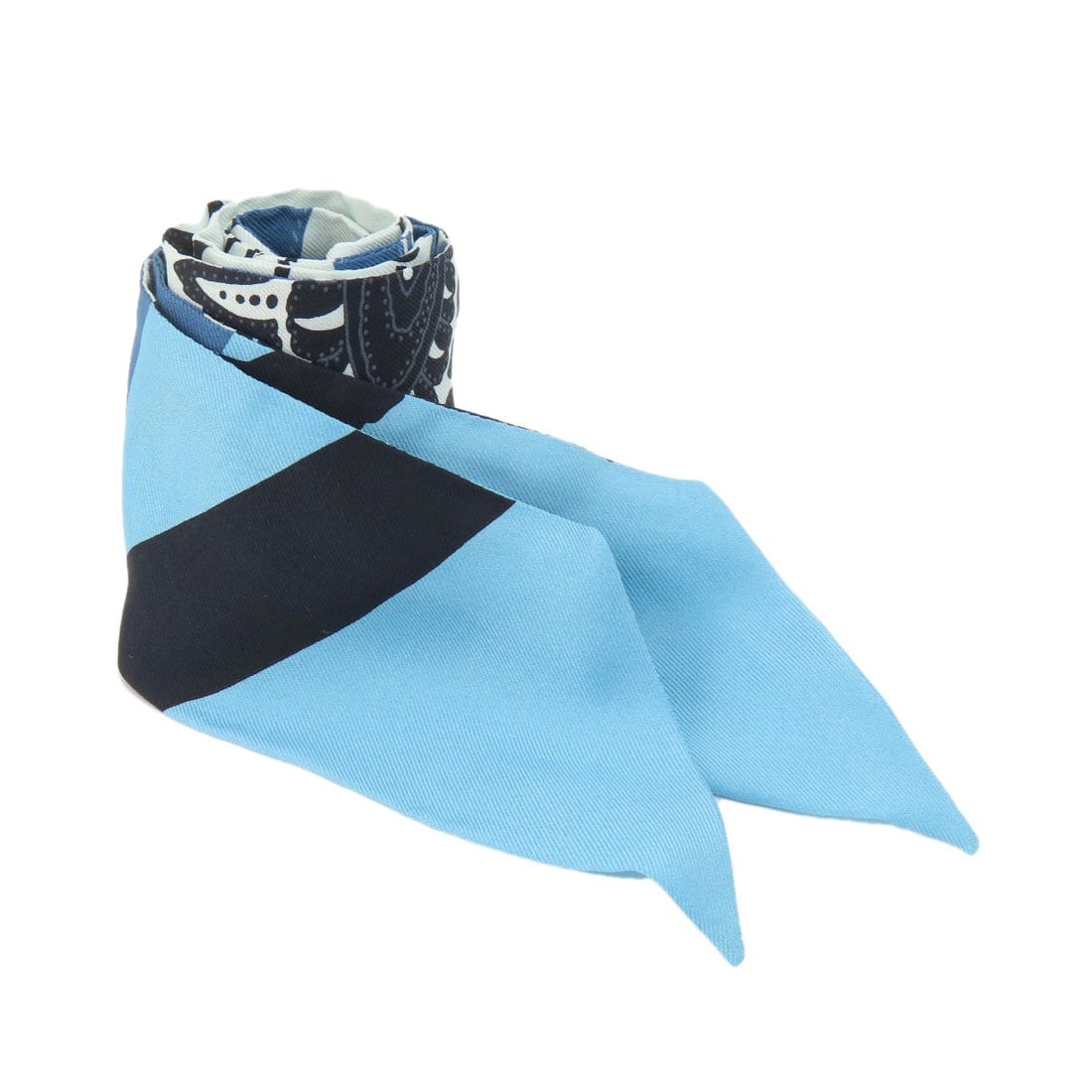 Hermes Twilly Scarf in Silk: Hermes Twilly Scarf in Silk The iconic Hermes Twilly Scarf is a timeless piece of elegance, boasting its signature blue and white striped pattern in high-quality silk. A true symbol of French sophisti