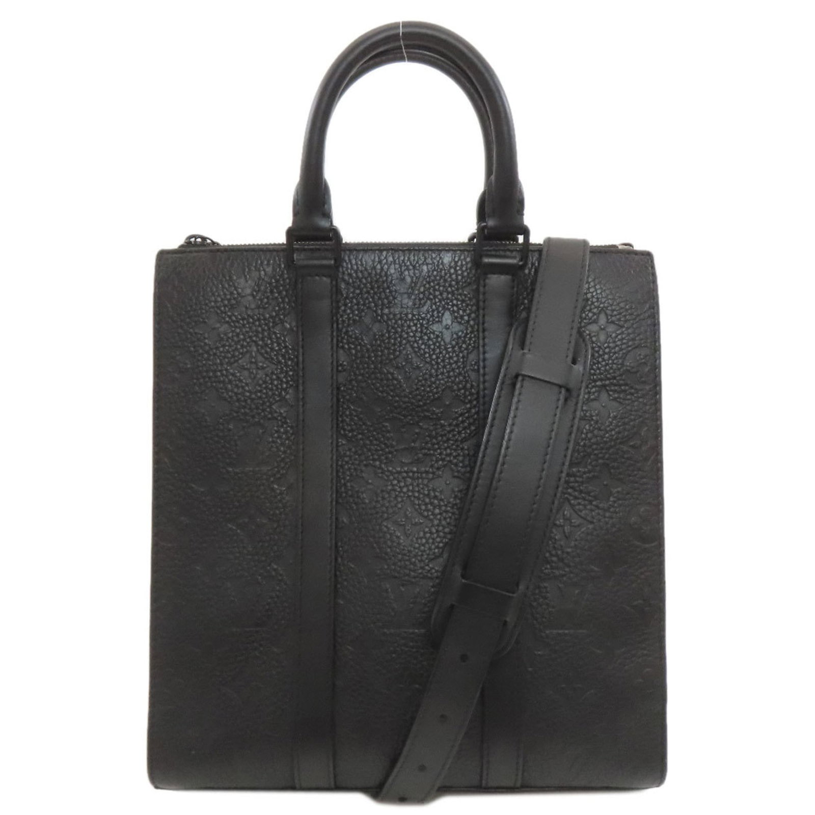 Louis Vuitton Leather Handbag: Louis Vuitton Leather Handbag A sleek and timeless classic, this Louis Vuitton leather handbag boasts the iconic monogram pattern and premium black leather construction. With its compact size and stur