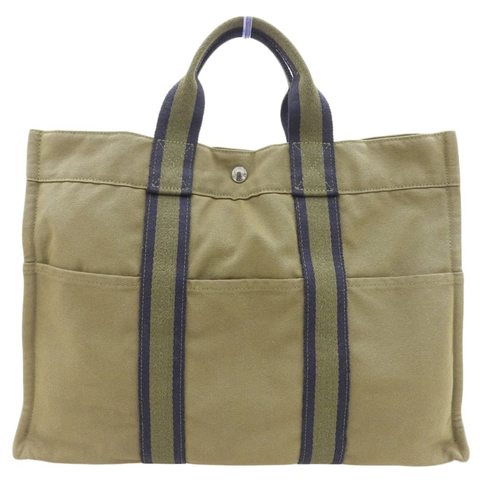Canvas Hermes Tote Bag: Canvas Hermes Tote Bag Authentic Hermes canvas tote bag in khaki and navy, boasting classic design with timeless appeal. With its durable canvas material and spacious interior, this versatile tote is
