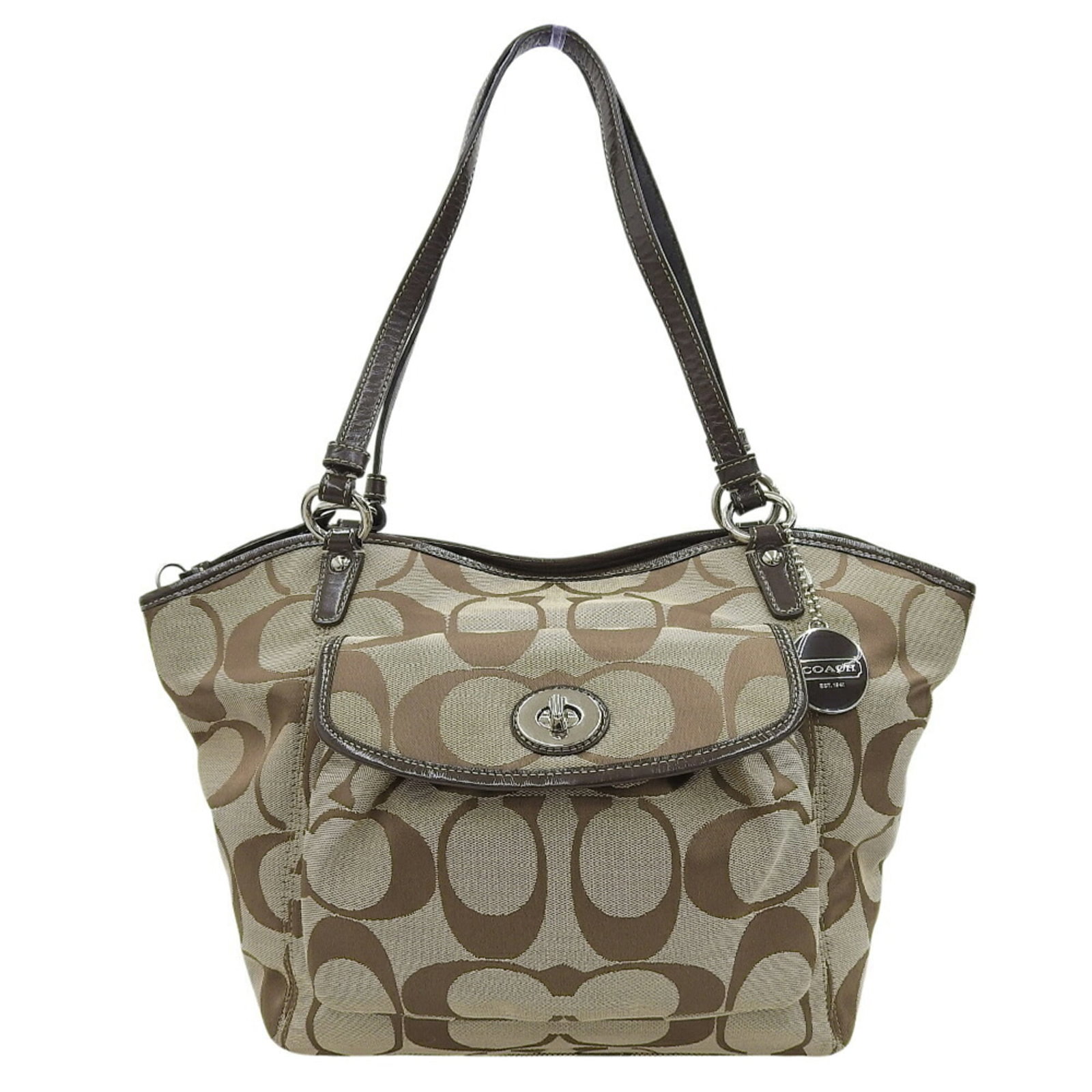 Canvas Coach Tote Bag: Canvas Coach Tote Bag A pre-owned Coach canvas tote bag in beautiful beige and brown hues, offering a timeless and stylish solution for daily errands and outings. With its classic design and durable c