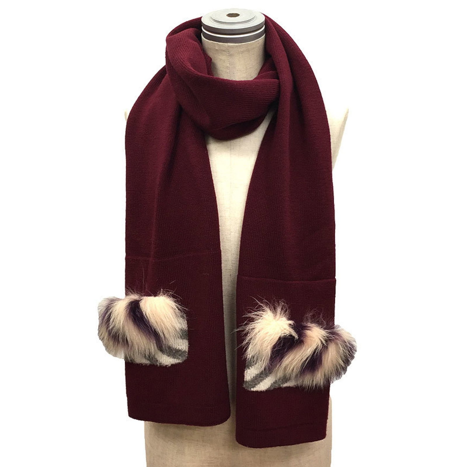 Wool Fendi Stole: Wool Fendi Stole Elevate your winter wardrobe with the luxurious Bordeaux wool Fendi stole, boasting a classic design and exceptional craftsmanship. Its 1.8m length and subtle 40cm width make it perfe