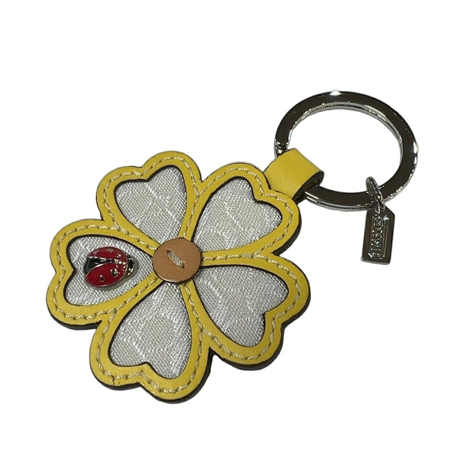 Keyring Coach: Keyring Coach A stylish and versatile accessory, this Coach keyring is a subtle touch of luxury that can add a pop of personality to any outfit. Made from high-quality materials, it boasts a crisp whi