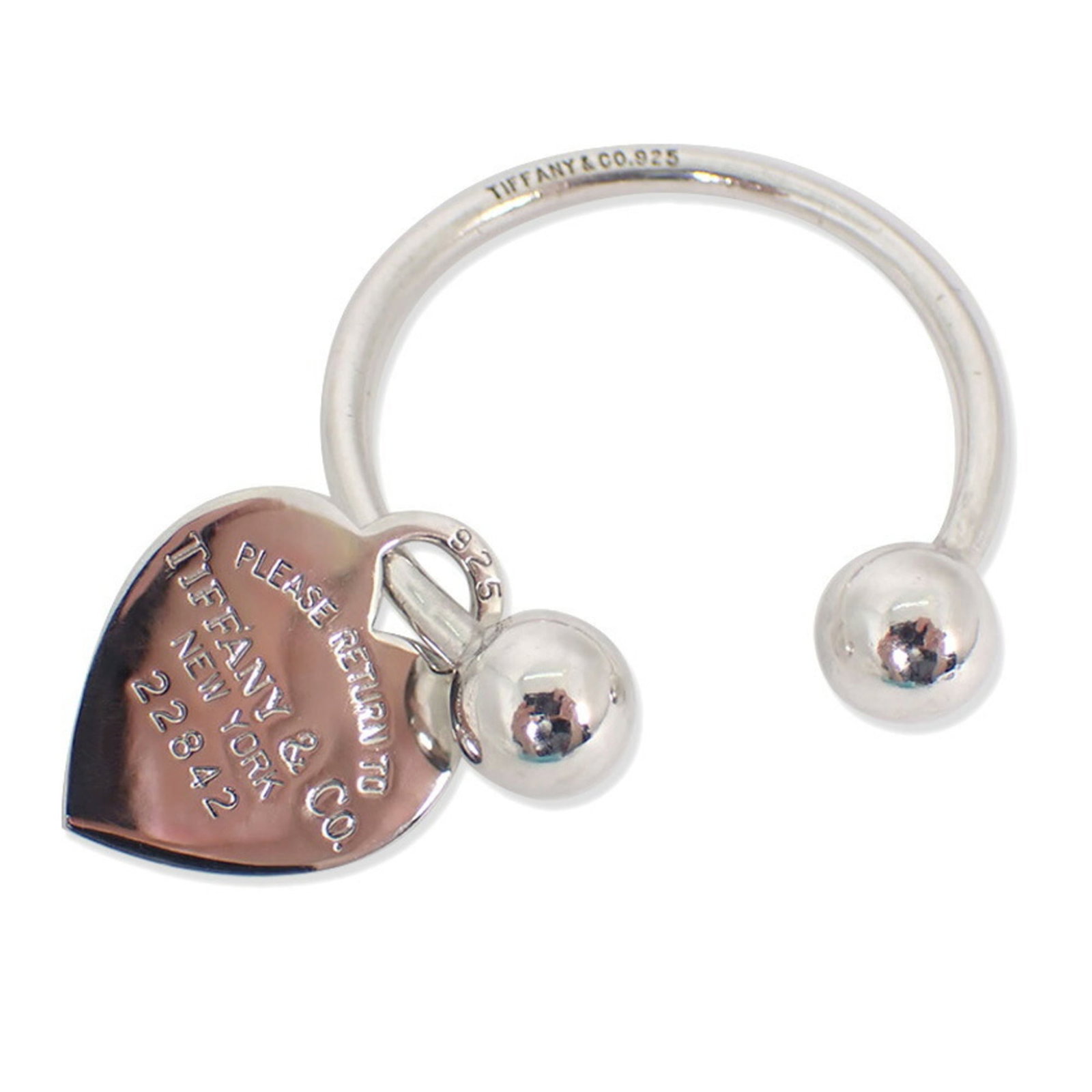 Sterling Silver 925 Tiffany Keyring: Sterling Silver 925 Tiffany Keyring A beautiful sterling silver 925 Tiffany keyring, adorned with a delicate heart charm, adds a touch of elegance to any outfit. Made from high-quality materials and c