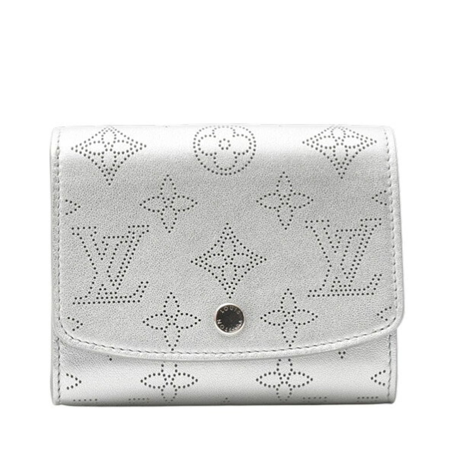 Louis Vuitton Bi-Fold Wallet: Louis Vuitton Bi-Fold Wallet A luxurious and timeless accessory, this Louis Vuitton bi-fold wallet boasts the iconic monogram pattern in striking Iris hue, paired with metallic silver accents for adde