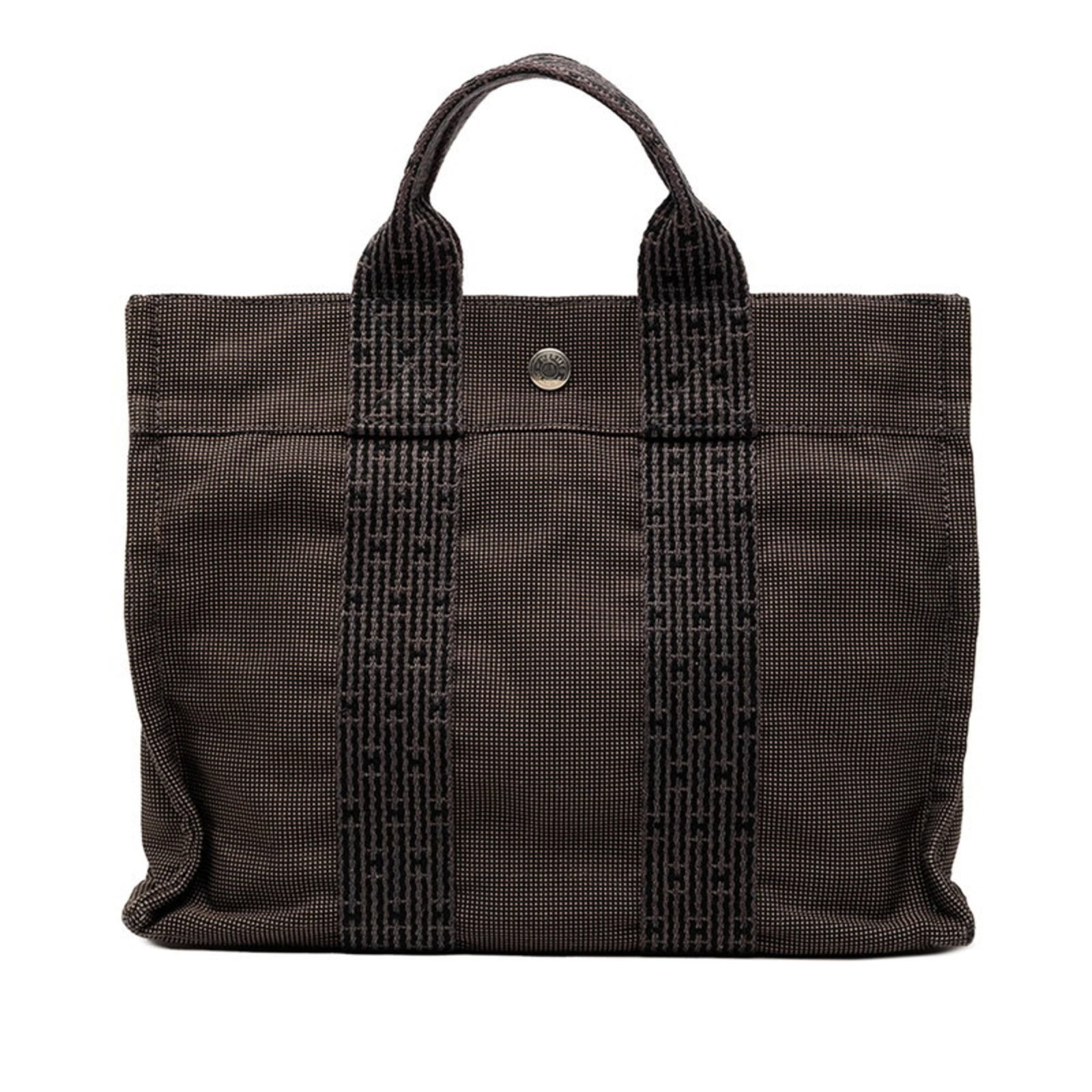 Hermes Canvas Tote Bag: Hermes Canvas Tote Bag A timeless and versatile canvas tote from the iconic French brand Hermes, boasting a sleek black and gray design with a sturdy zipper closure and spacious open pocket for everyd