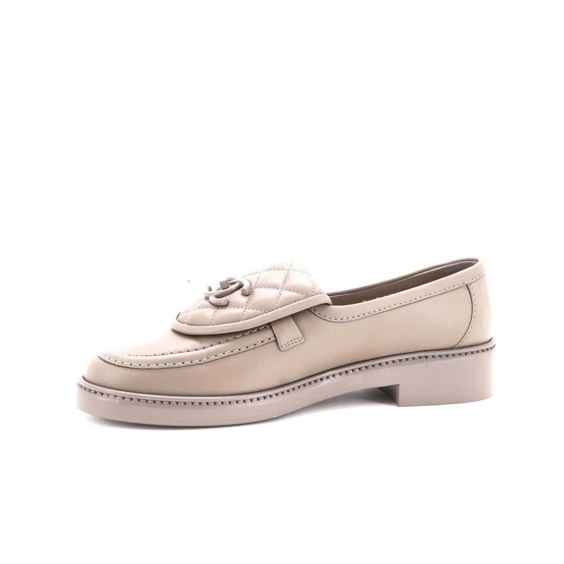 Chanel Women's CC Quilted Leather Loafers: Chanel Women's CC Quilted Leather Loafers Elevate your shoe game with the iconic Chanel Women's CC Quilted Leather Loafers, boasting a timeless neutral design that exudes sophistication and elegance.