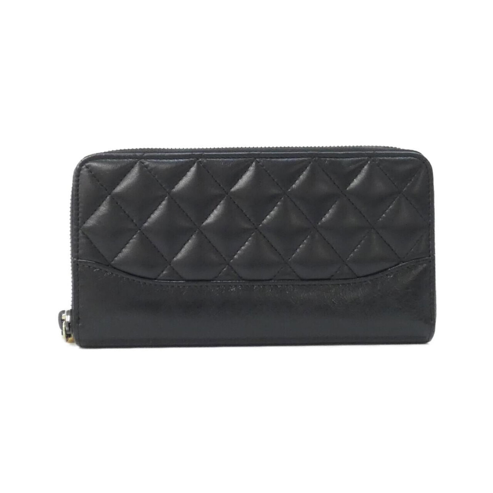 Chanel Bi-Fold Leather Wallet: Chanel Bi-Fold Leather Wallet A timeless piece from the iconic Chanel brand, this bi-fold leather wallet boasts classic design and premium quality. Made from rich calfskin leather, its sleek black fin