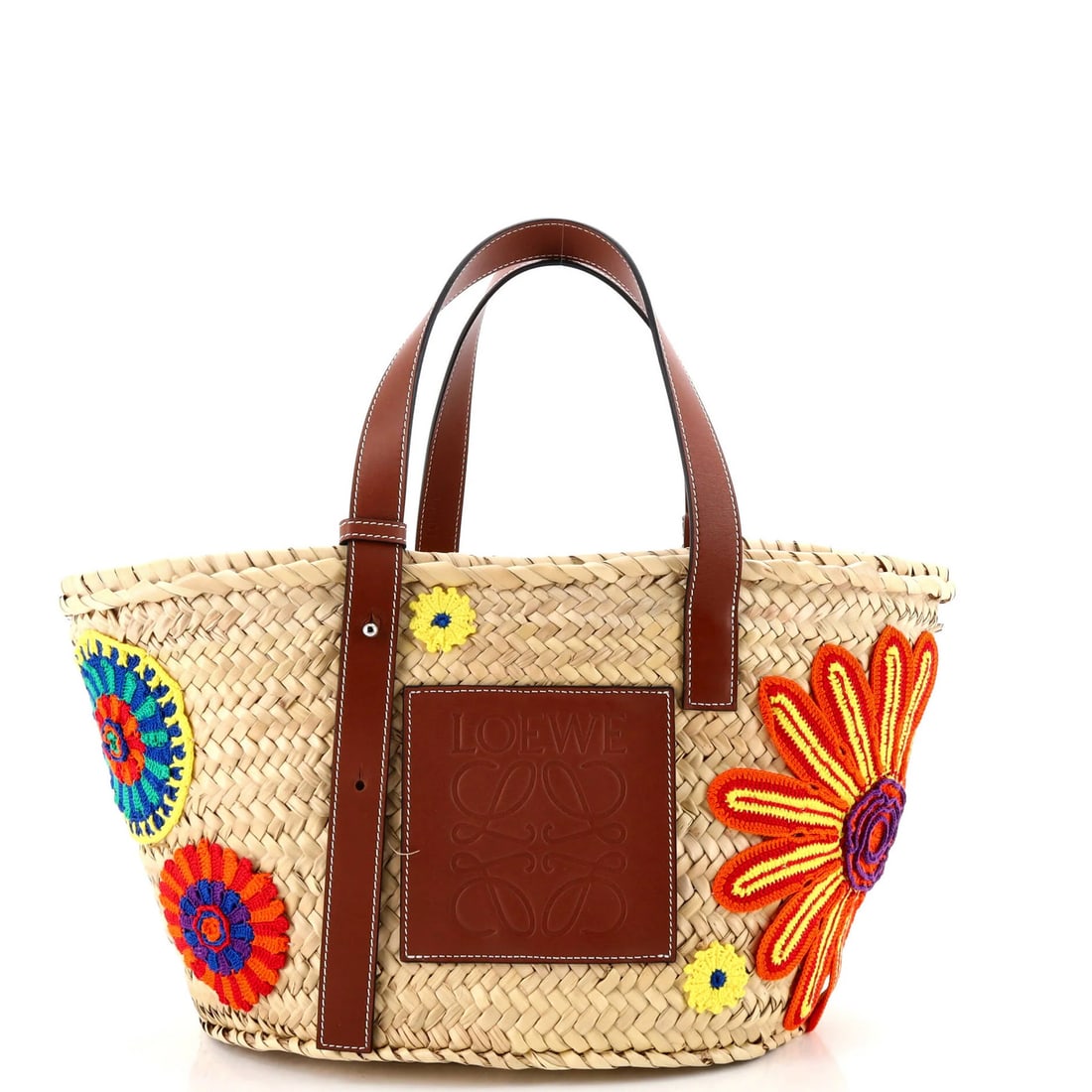 Medium Loewe Basket Tote Woven Raffia with Applique: Medium Loewe Basket Tote Woven Raffia with Applique Elevate your everyday style with the iconic Loewe Basket Tote, crafted from richly woven raffia that adds a touch of effortless sophistication to an