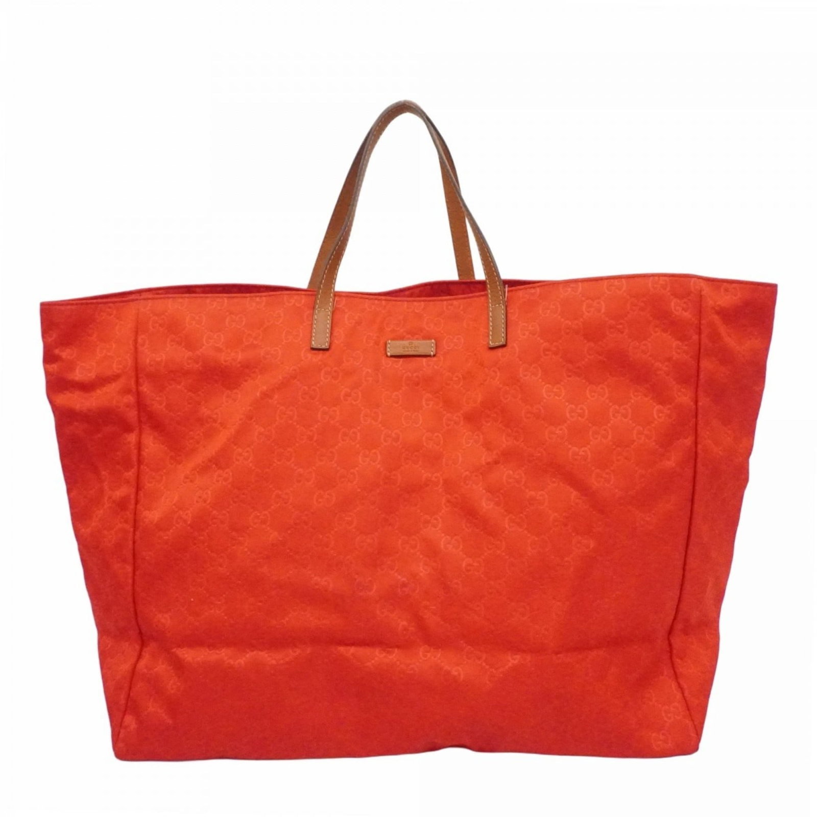 Gucci Tote Bag in Nylon: Gucci Tote Bag in Nylon A vibrant red Gucci tote bag in excellent condition, boasting the iconic nylon material and champagne gold hardware that defines this timeless piece. With its spacious interior