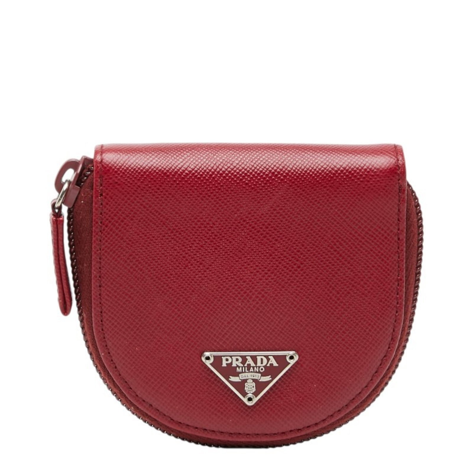 Prada Coin Purse in Leather: Prada Coin Purse in Leather A vibrant red Prada coin purse in excellent condition, crafted from durable Saffiano leather that has developed a beautiful patina over time. With its sleek design and comp