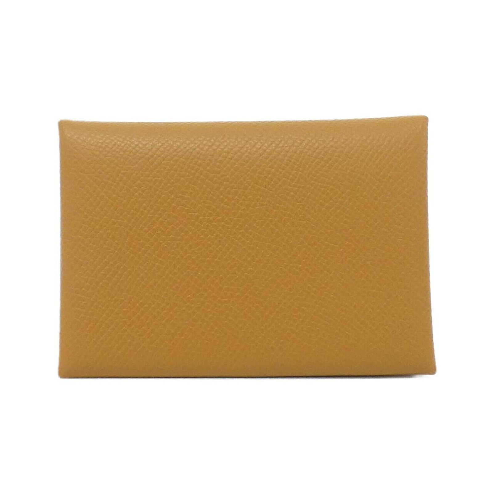 Hermes Coin Purse/ Case Epsom Leather: Hermes Coin Purse/ Case Epsom Leather A beautifully crafted Epsom leather coin purse from the iconic French fashion house Hermes, this caramel-colored case is both elegant and practical. Its classic d