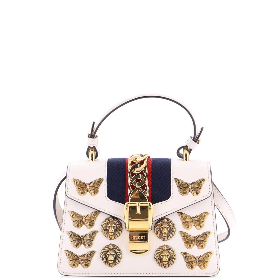 Gucci Sylvie Mini Top Handle Bag in Embellished Leather: Gucci Sylvie Mini Top Handle Bag in Embellished Leather The Gucci Sylvie Mini Top Handle Bag is a stylish and versatile accessory that exudes luxury with its embellished leather exterior and neutral c