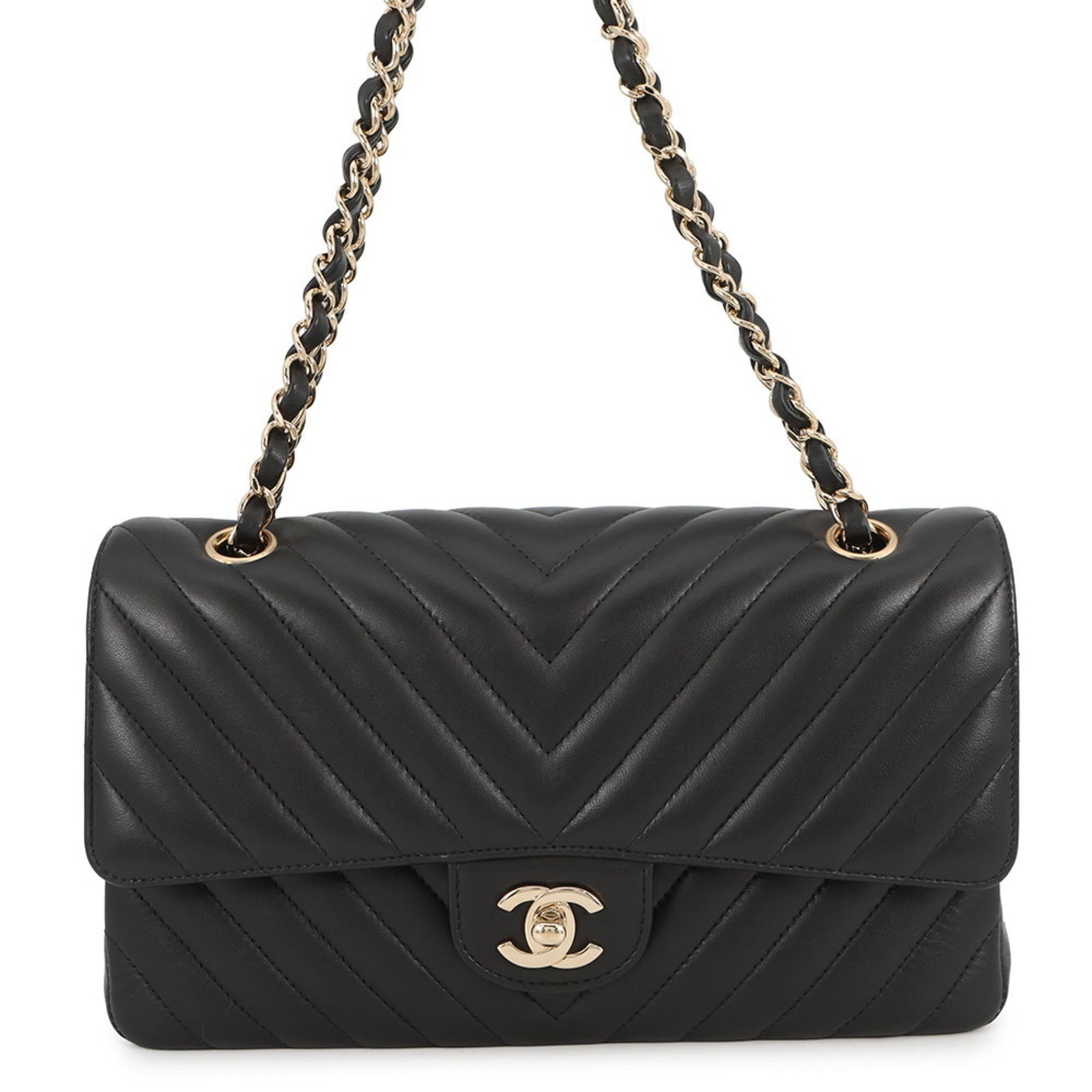 Chanel Shoulder Bag in Leather: Chanel Shoulder Bag in Leather A sleek and sophisticated Chanel shoulder bag in luxurious lambskin leather, this timeless piece exudes classic elegance with its understated black hue. With its compact
