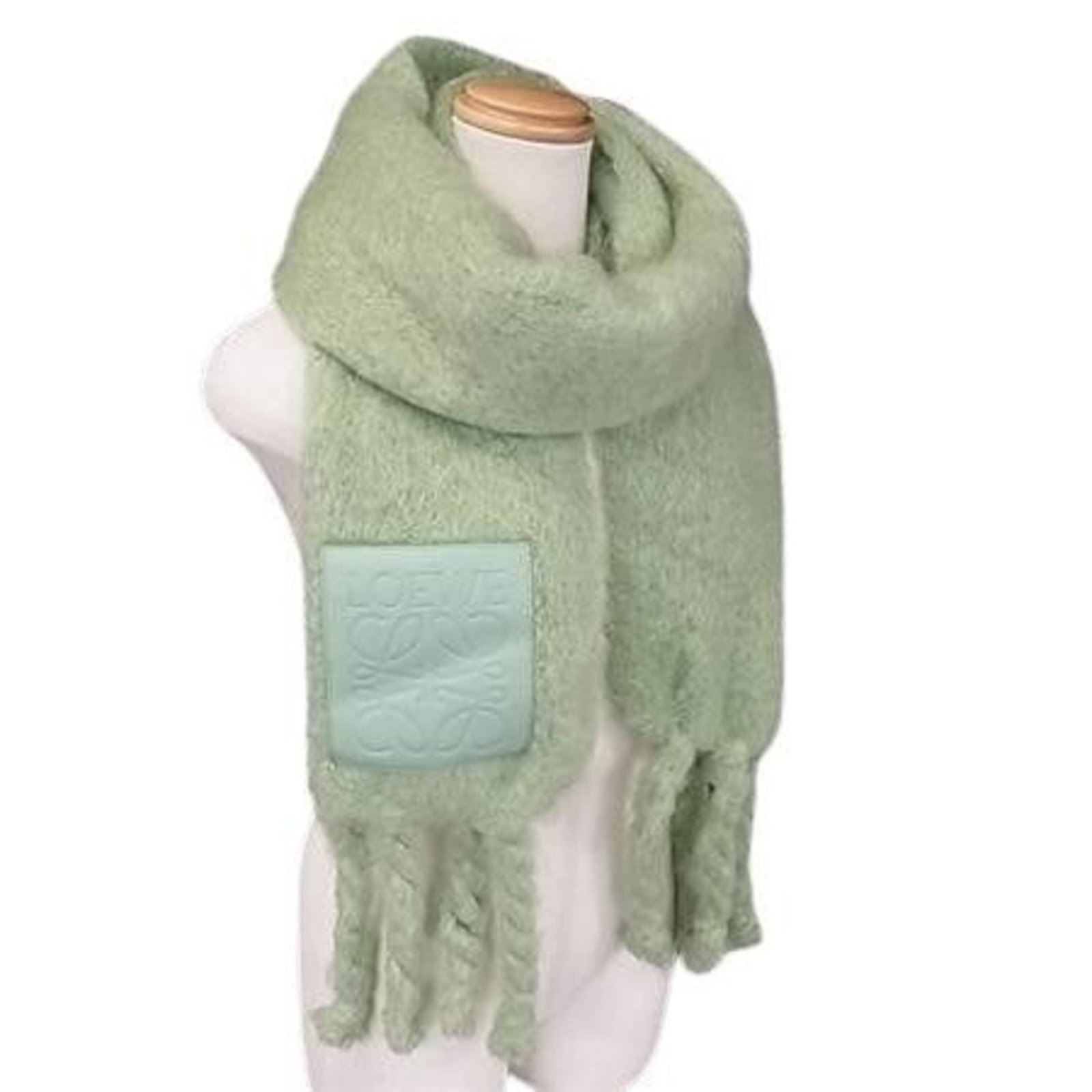 Nylon - Loewe Shawl Wool - Mohair: Nylon - Loewe Shawl Wool - Mohair A stylish and versatile shawl from renowned Spanish luxury brand Loewe, crafted from a unique blend of wool, mohair, and nylon for added durability. Its vibrant green
