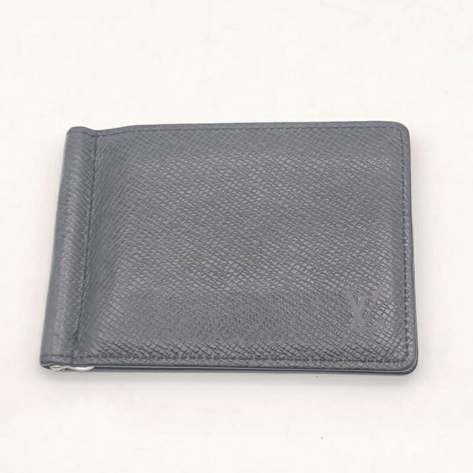 Louis Vuitton Card Wallet in Taiga Leather: Louis Vuitton Card Wallet in Taiga Leather A sleek and sophisticated accessory for the modern gentleman, this Louis Vuitton Card Wallet in Taiga Leather boasts a timeless design that exudes luxury and