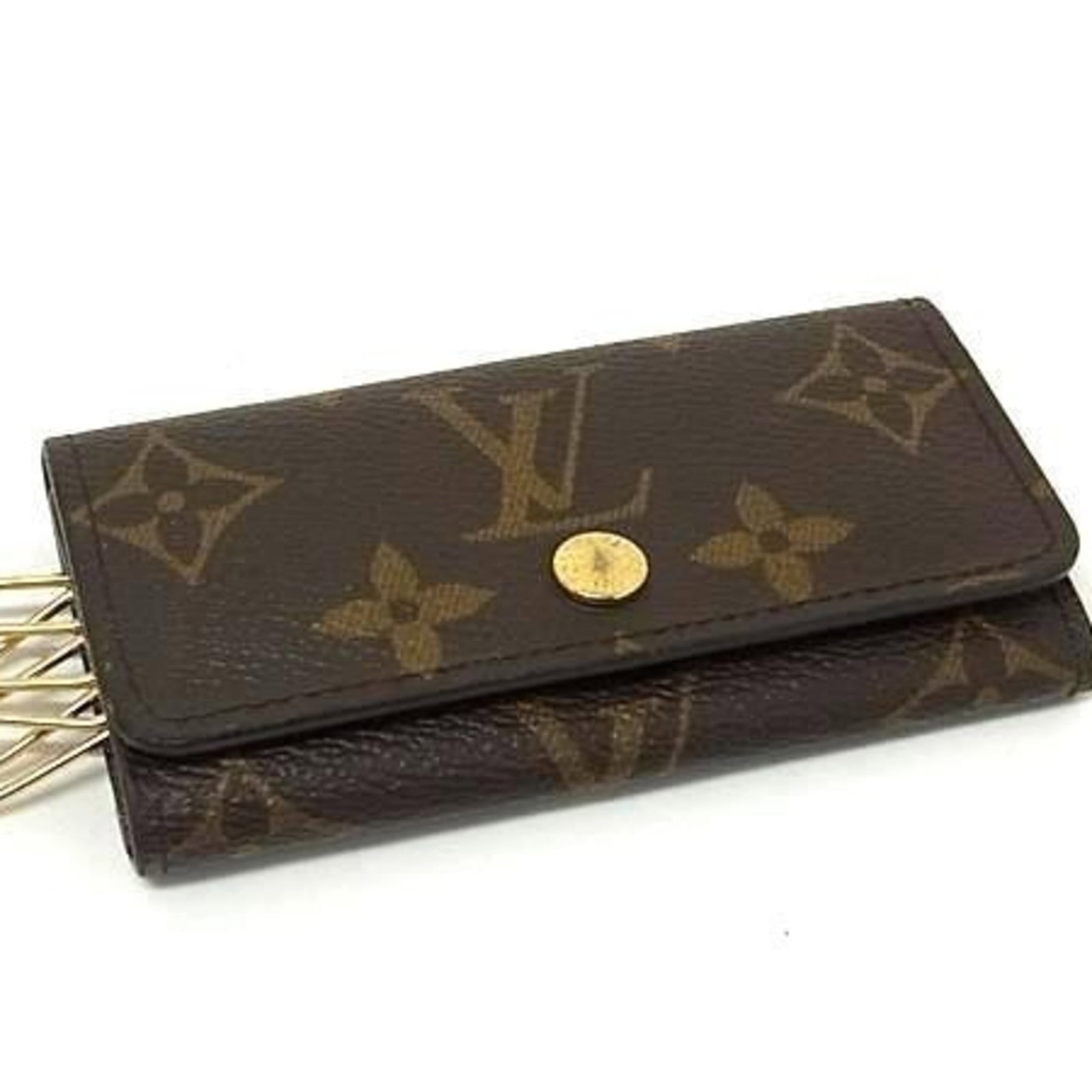 Louis Vuitton Monogram Keycase: Louis Vuitton Monogram Keycase Elevate your daily essentials with the iconic Louis Vuitton Monogram Keycase, boasting the signature brown monogram pattern that exudes luxury and sophistication. This
