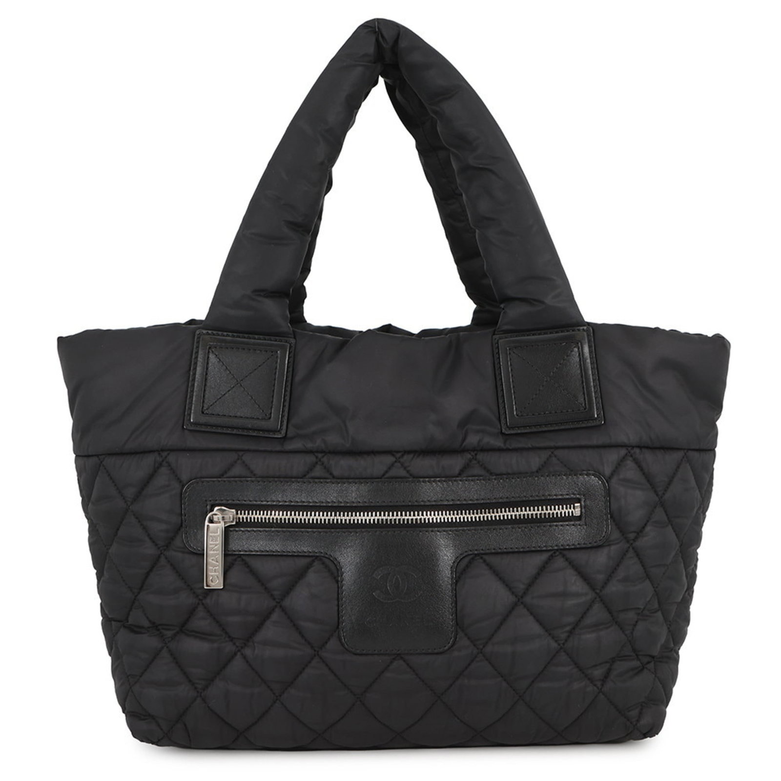 Chanel Tote Bag in Nylon: Chanel Tote Bag in Nylon A timeless Chanel tote in black nylon, perfect for everyday use, boasts a sleek and sophisticated design that exudes classic French chic. With its durable nylon material and s