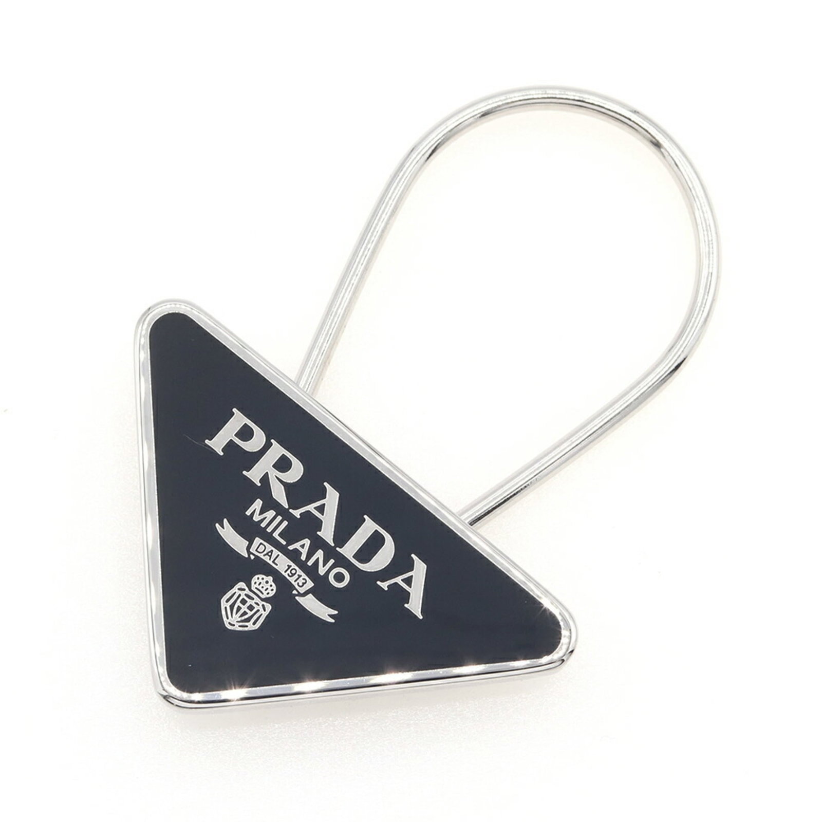 Metal Prada Keyring: Metal Prada Keyring A sleek and sophisticated accessory for the modern woman, this Prada metal keyring is crafted from high-quality metal and boasts a timeless design that exudes luxury. Its compact s