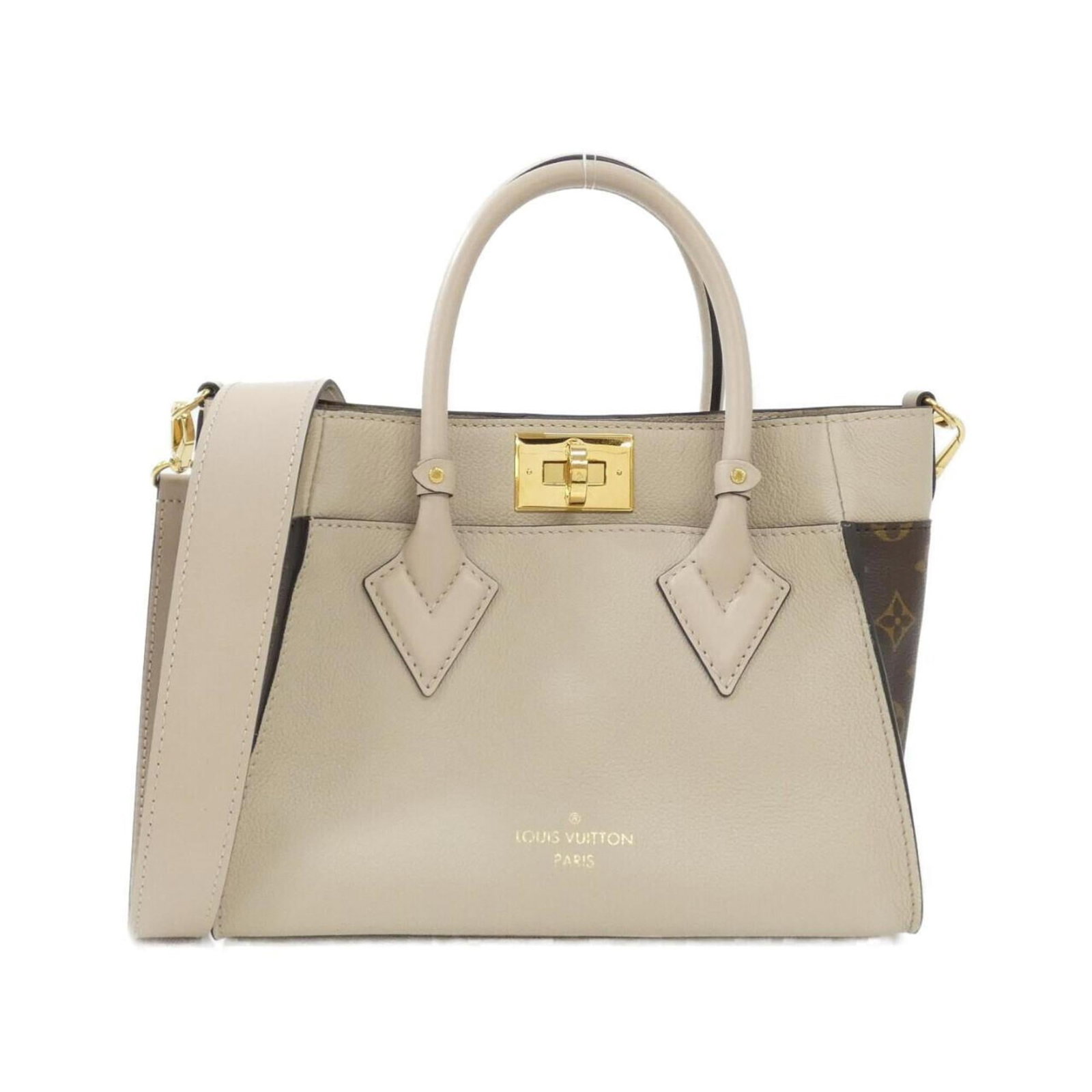 Louis Vuitton Coated Canvas Handbag: Louis Vuitton Coated Canvas Handbag Experience the timeless elegance of Louis Vuitton with this stunning coated canvas handbag, boasting a sleek grayish hue and classic design that exudes sophisticati