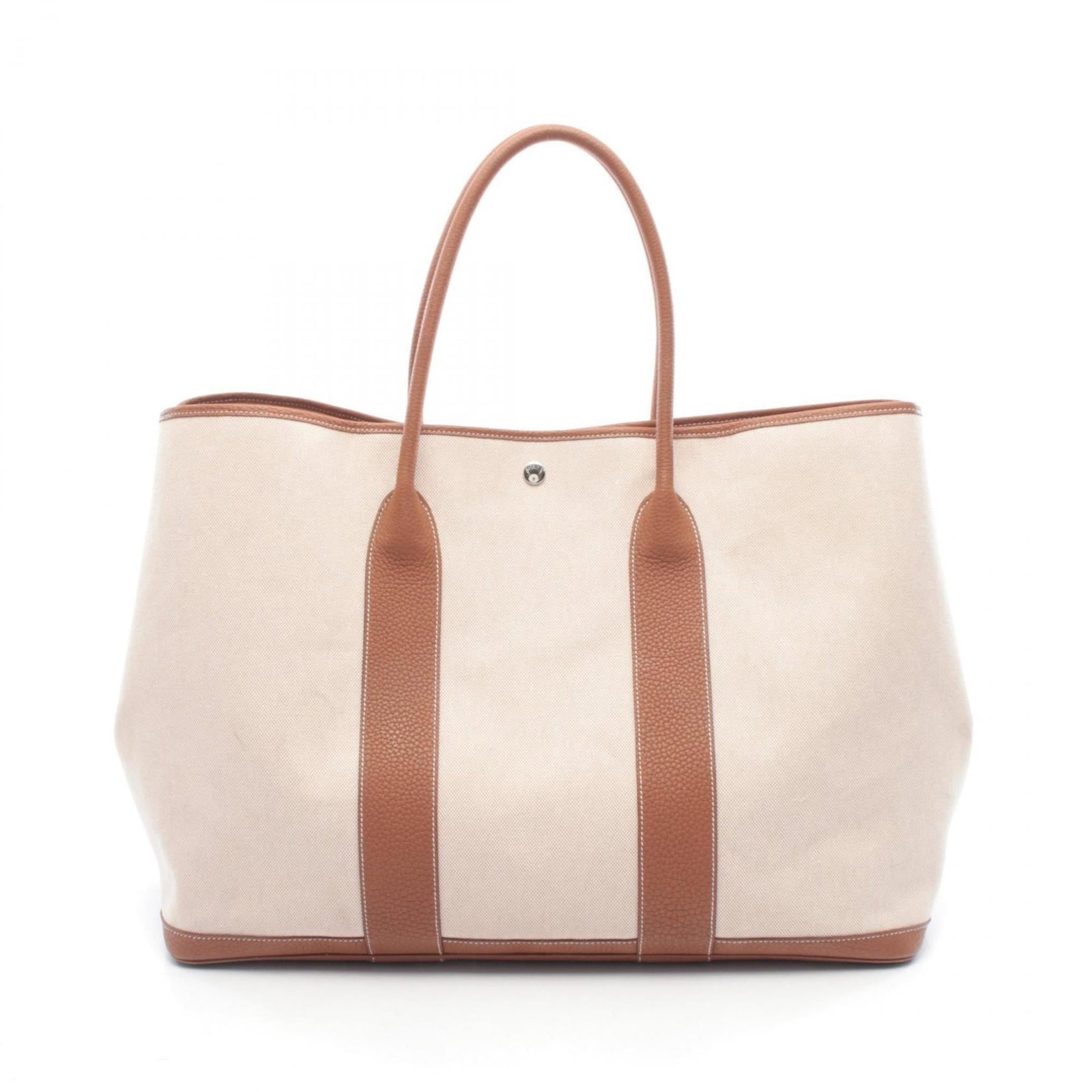 Hermes Tote Bag Canvas Toile: Hermes Tote Bag Canvas Toile A classic canvas tote from the iconic French fashion house Hermes, this timeless piece boasts a beautiful brown and ecru toile print in excellent condition despite its use