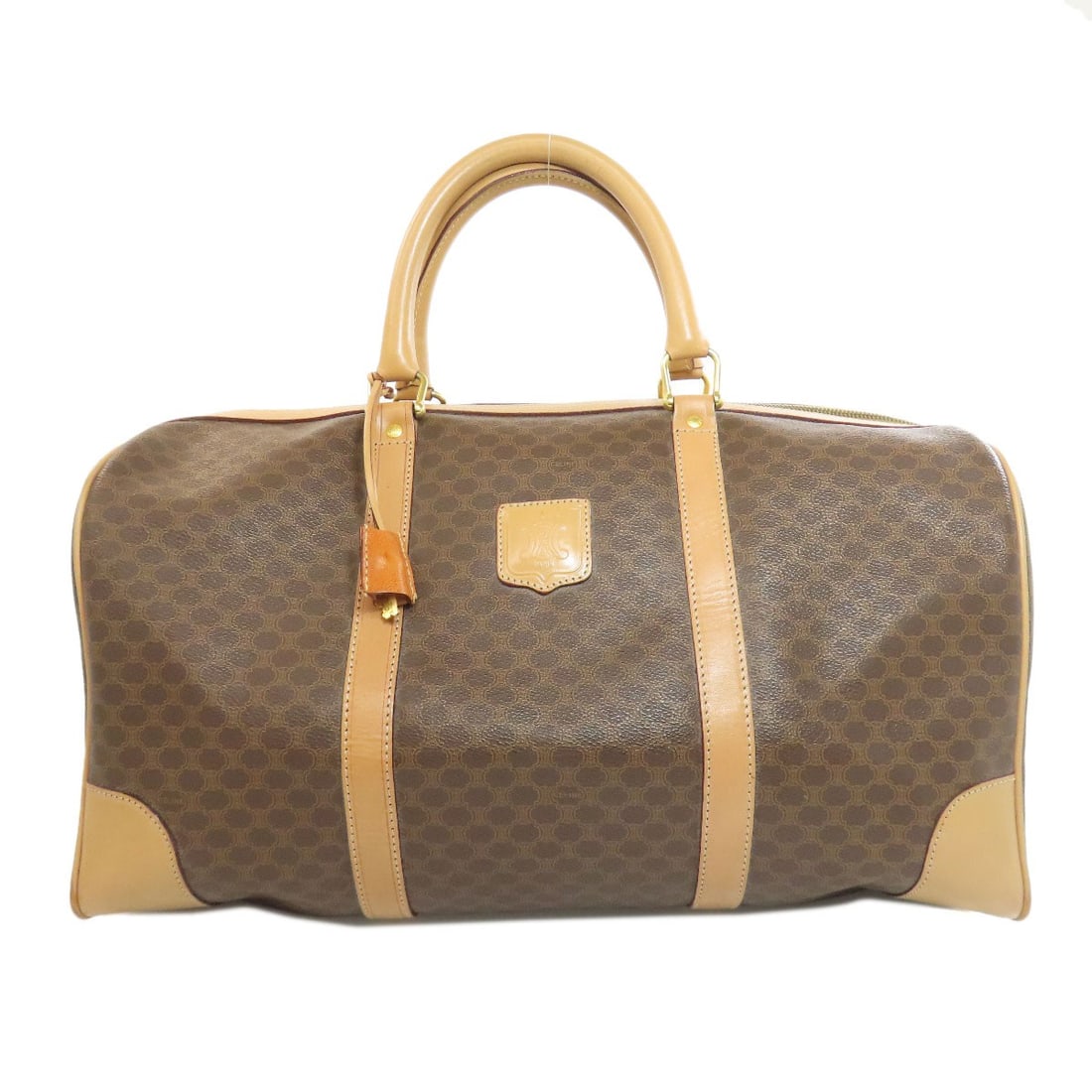Celine Macadam Pattern Boston Bag in PVC: Celine Macadam Pattern Boston Bag in PVC Elevate your everyday style with the iconic Celine Boston bag, crafted from premium PVC that adds a touch of modern sophistication to any outfit. The classic d