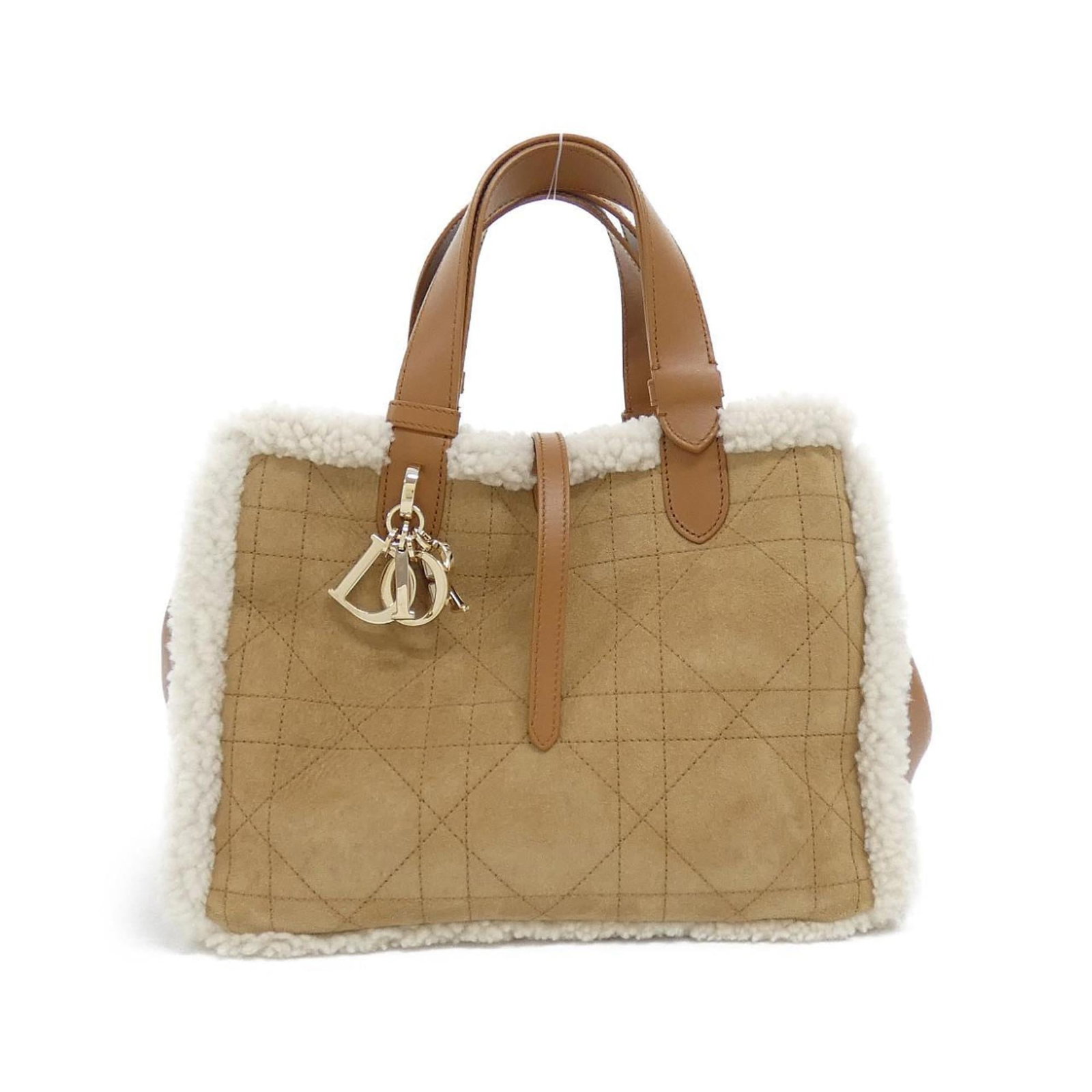 Pouch Suede - Christian Dior Handbag: Pouch Suede - Christian Dior Handbag A stunning Christian Dior pouch handbag in rich beige suede, adorned with elegant gold hardware, adds a touch of sophistication to any outfit. With its classic des