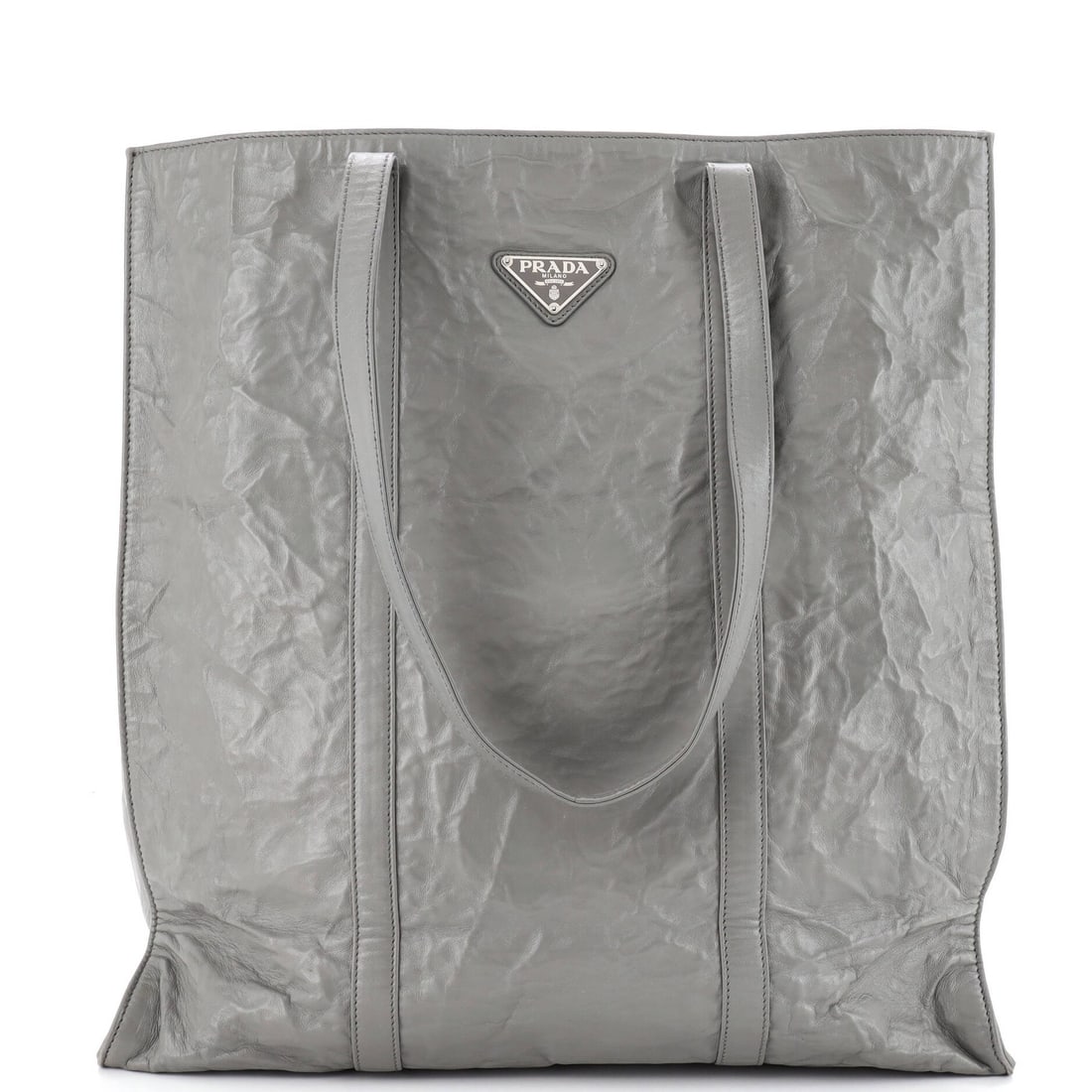 Prada Shopper Tote in Antique Nappa Medium: Prada Shopper Tote in Antique Nappa Medium A timeless Prada Shopper Tote in Antique Nappa Medium exudes understated elegance with its rich gray exterior and supple leather interior. With its classic d