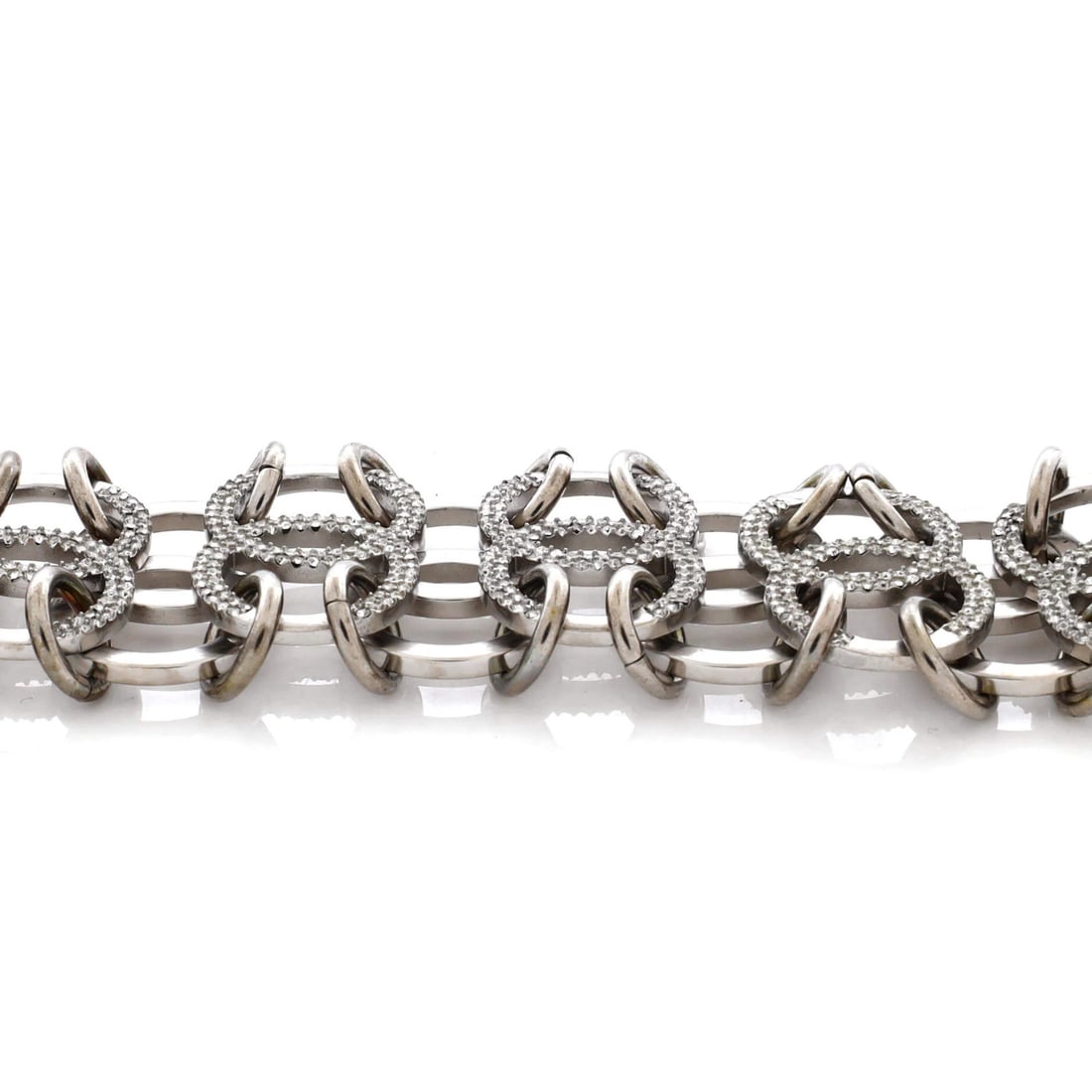 Chanel In The Air Link Bracelet in Metal with Crystals: Chanel In The Air Link Bracelet in Metal with Crystals Elevate your style with the iconic Chanel In The Air Link Bracelet, boasting sleek silver metal and sparkling crystals that add a touch of luxury