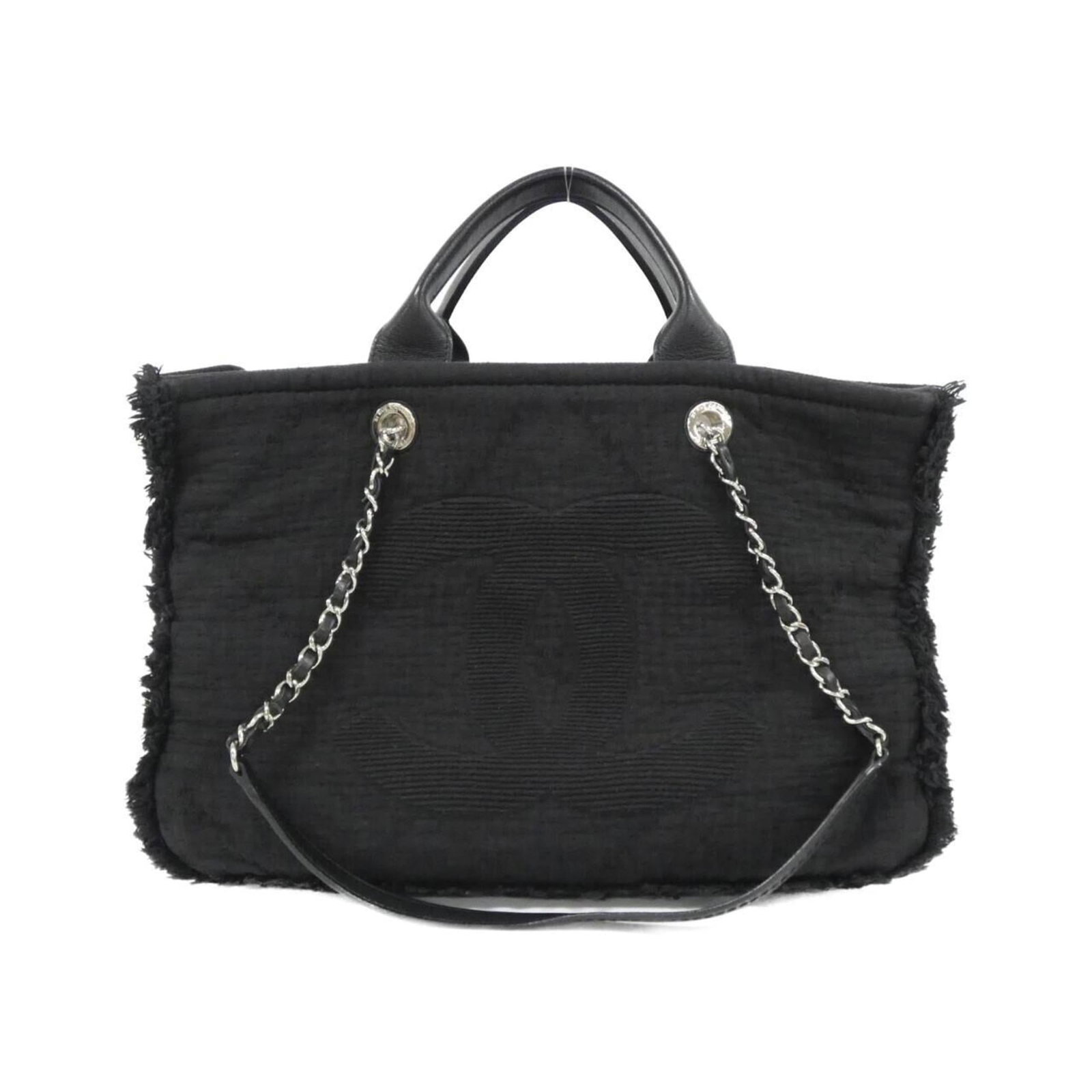 Chanel Canvas Handbag: Chanel Canvas Handbag A timeless and sophisticated Chanel canvas handbag in sleek black, adorned with elegant silver hardware, is up for grabs. With its classic design and durable canvas material, thi
