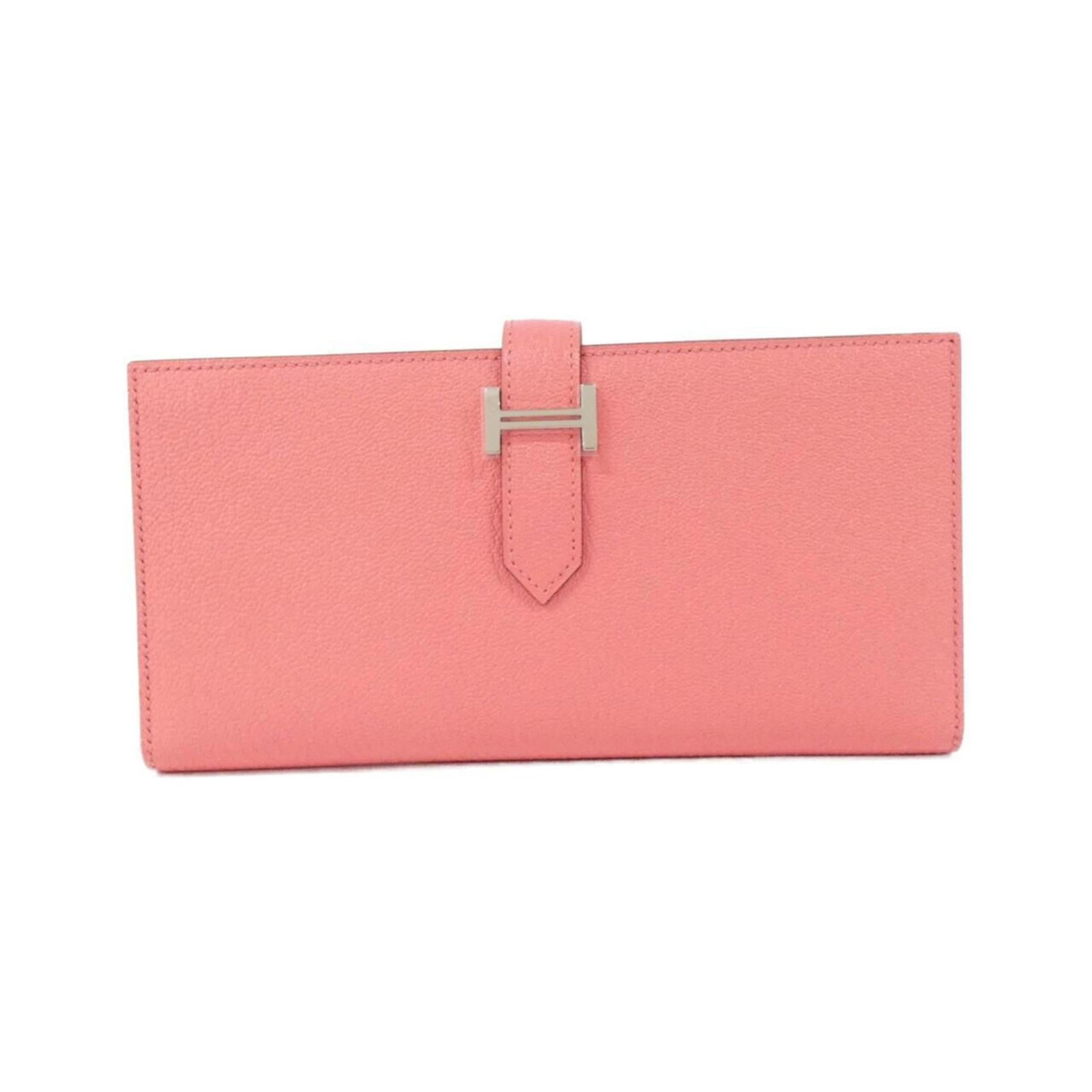 Hermes Bi-Fold Chevre Leather Wallet: Hermes Bi-Fold Chevre Leather Wallet A rare find for the discerning collector, this Herm?s bi-fold wallet boasts rich chevre leather in a vibrant pink hue, perfectly balanced by its sleek and sophisti
