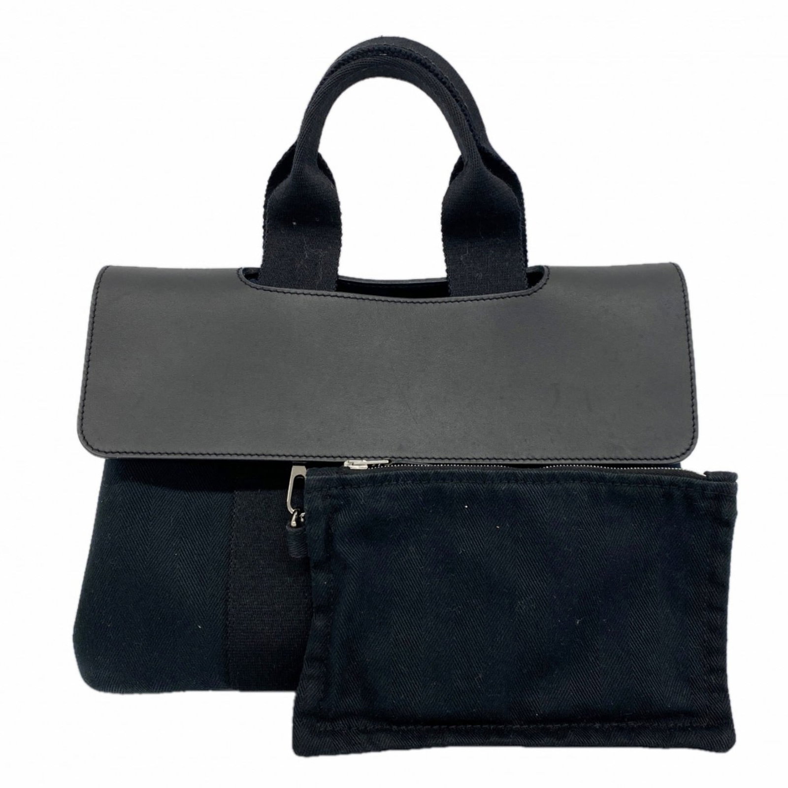 Chevron Hermes Handbag Toile: Chevron Hermes Handbag Toile A stunning black Chevron Toile handbag from the iconic French fashion house Hermes, boasting sleek silver hardware and a timeless design that exudes elegance. With its cla