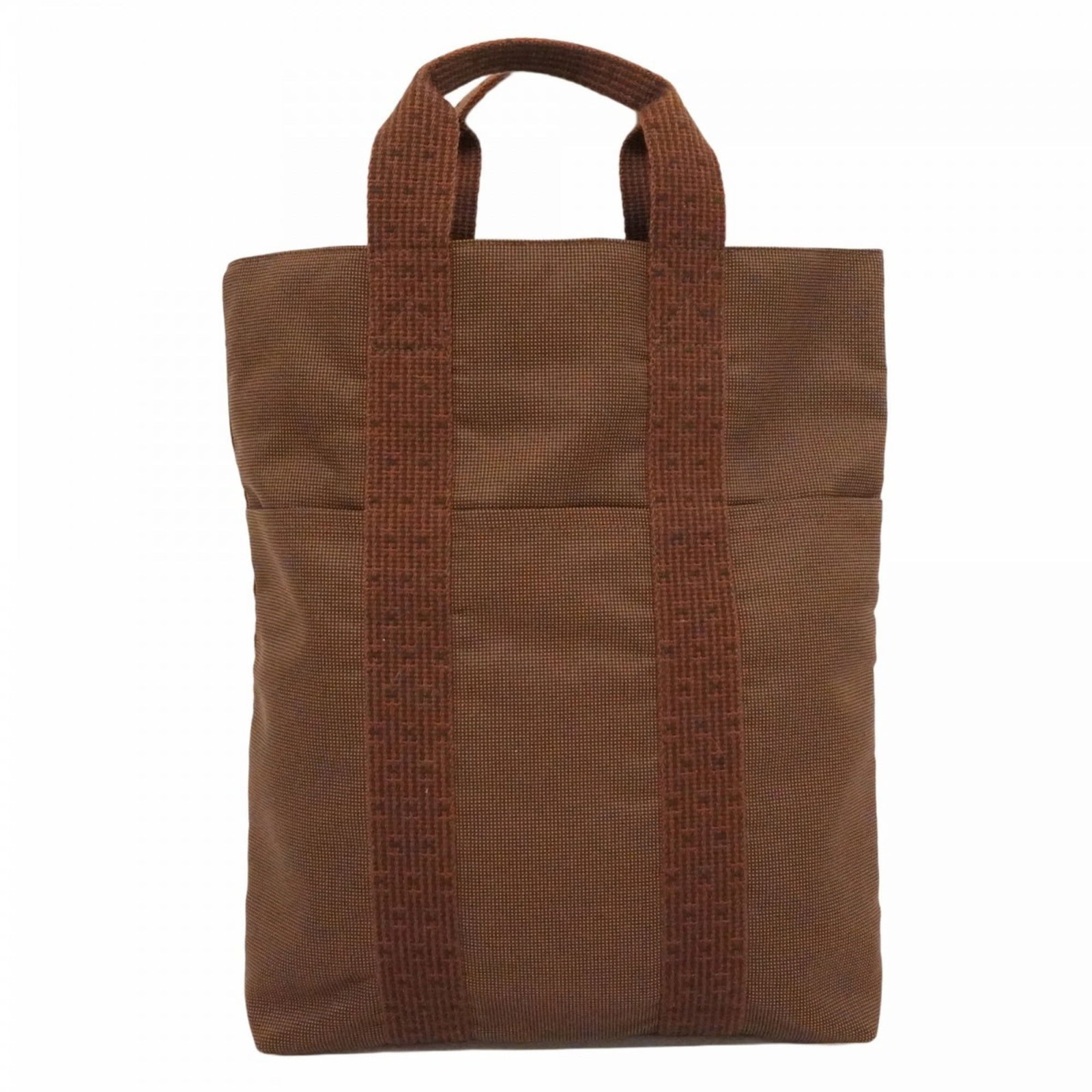Canvas Hermes Tote Bag: Canvas Hermes Tote Bag A pre-owned canvas tote bag from the iconic French fashion house Hermes, boasting its signature brown leather and silver hardware details. With its classic 40cm x 30cm size and
