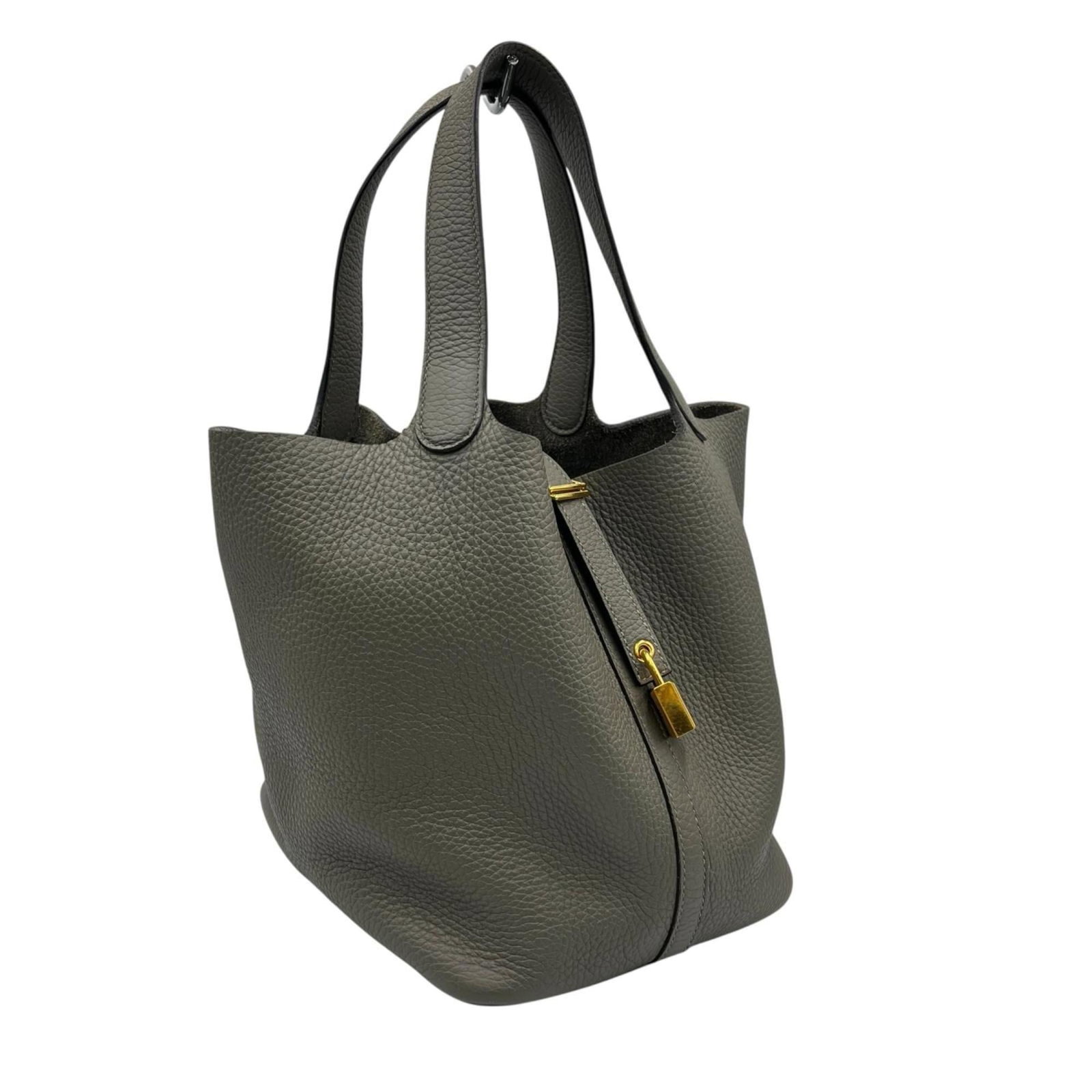 Hermes Leather Handbag: Hermes Leather Handbag A pre-owned Hermes leather handbag in a beautiful gray hue, boasting the iconic brand's signature craftsmanship and timeless design. With its compact size and sturdy 22cm x 22cm