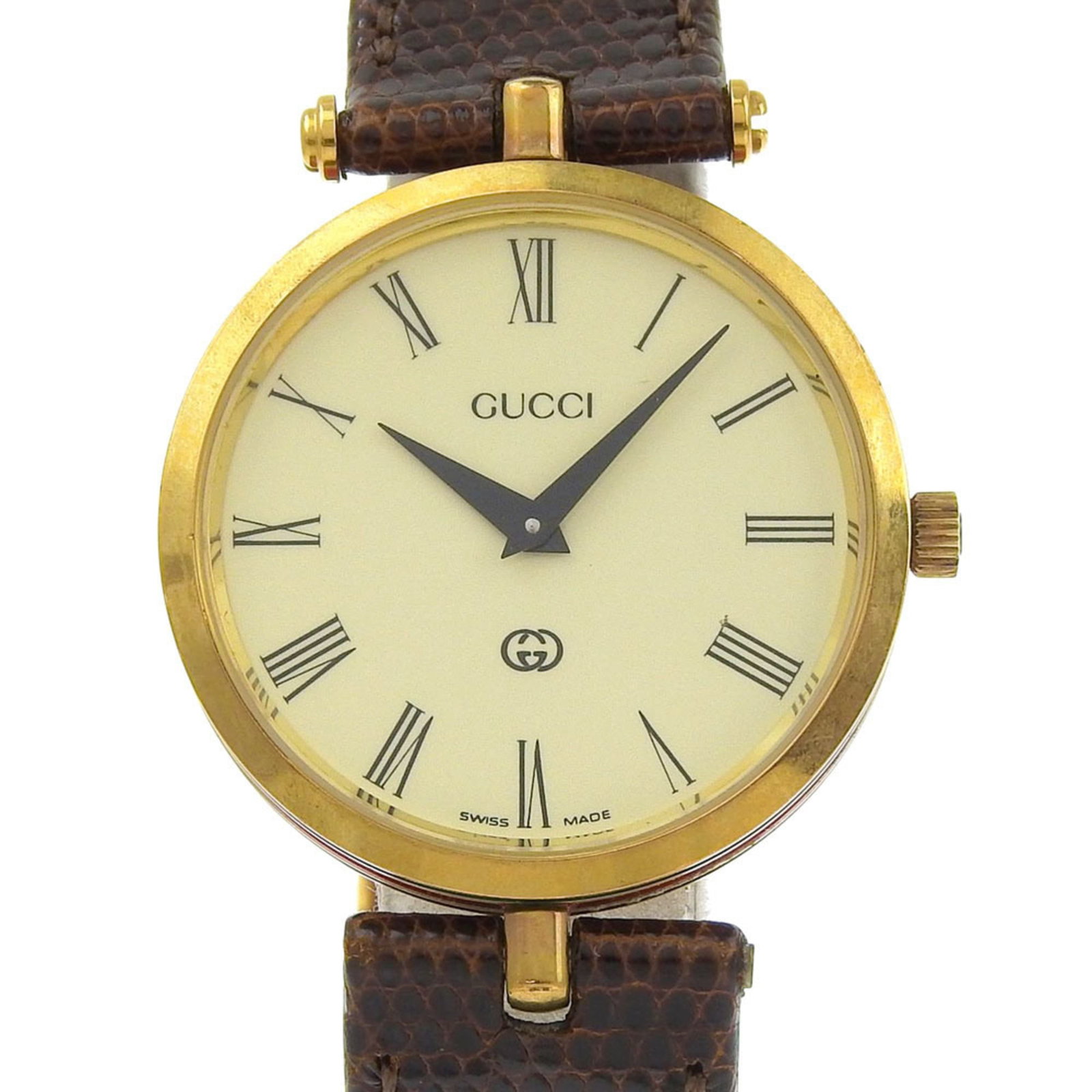 Wristwatch Gucci: Wristwatch Gucci A luxurious Gucci gold plated wristwatch, boasting an elegant ivory dial and 30mm case diameter, is up for grabs. With its classic design and refined details, this pre-owned timepiece