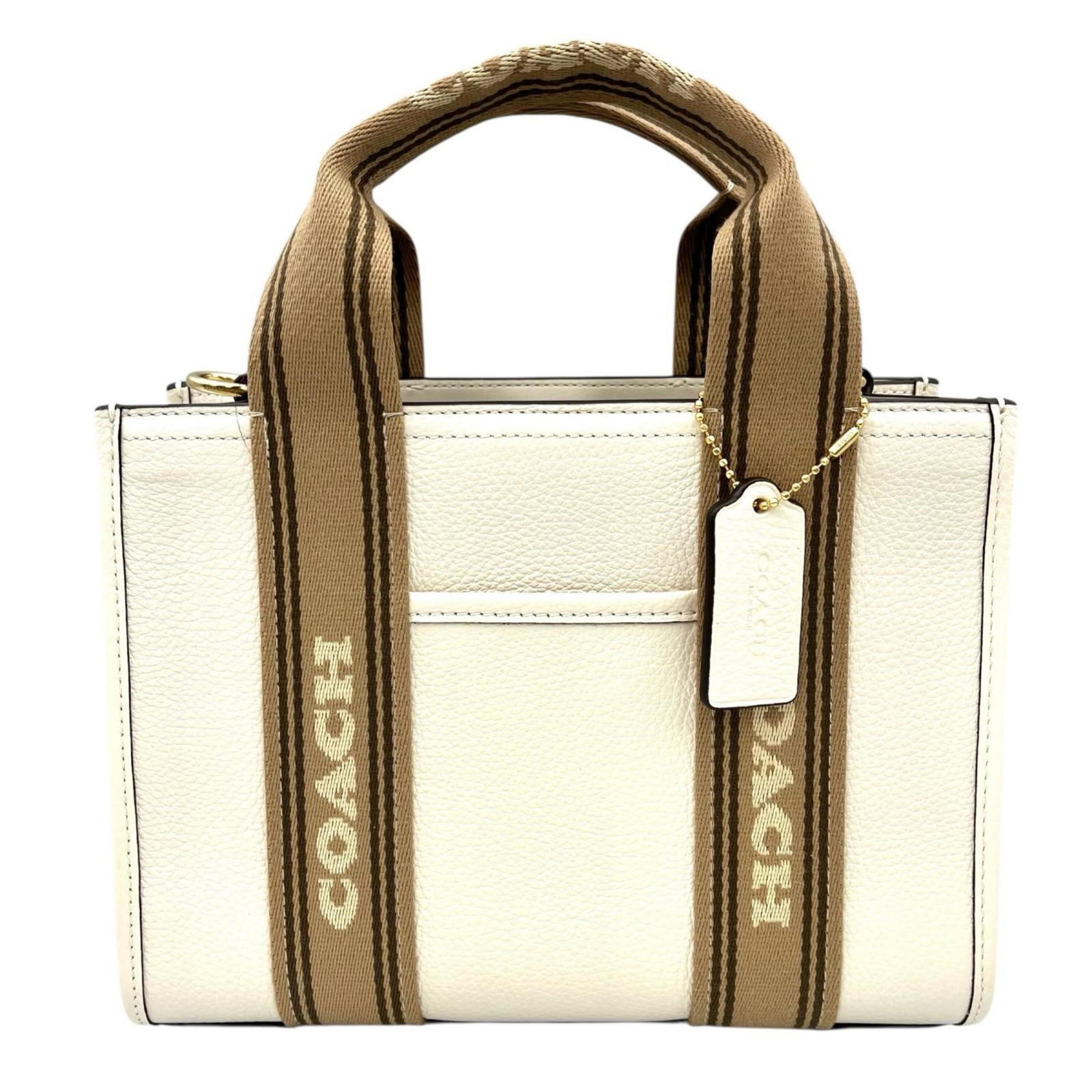 Coach Leather Handbag: Coach Leather Handbag A pristine Coach leather handbag in crisp white, waiting to be filled with your essentials. With its classic design and high-quality materials, this bag exudes timeless elegance