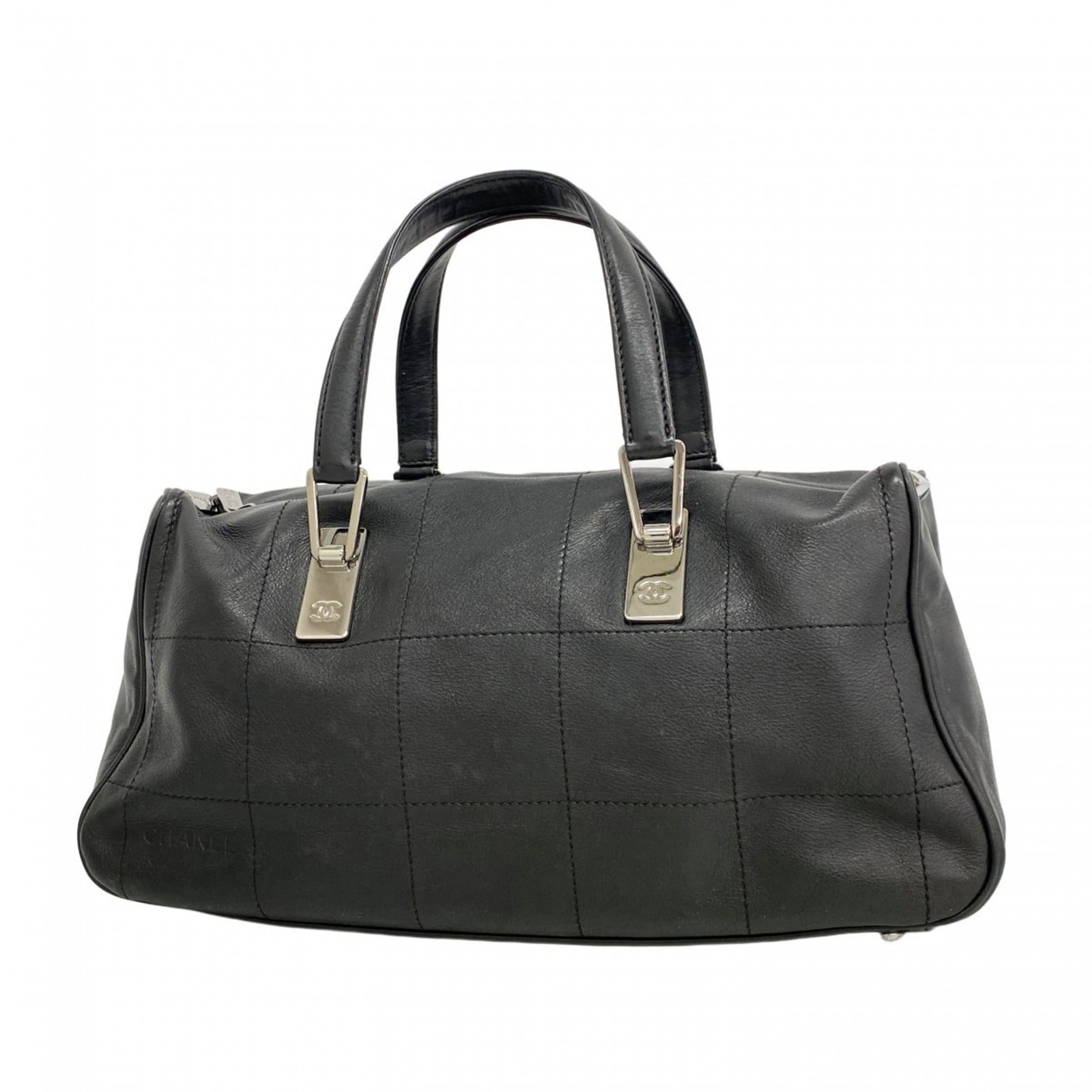 Leather Chanel Handbag: Leather Chanel Handbag A classic Chanel black leather handbag, exuding timeless elegance and sophistication. With its sleek silver hardware and premium leather construction, this stylish accessory is