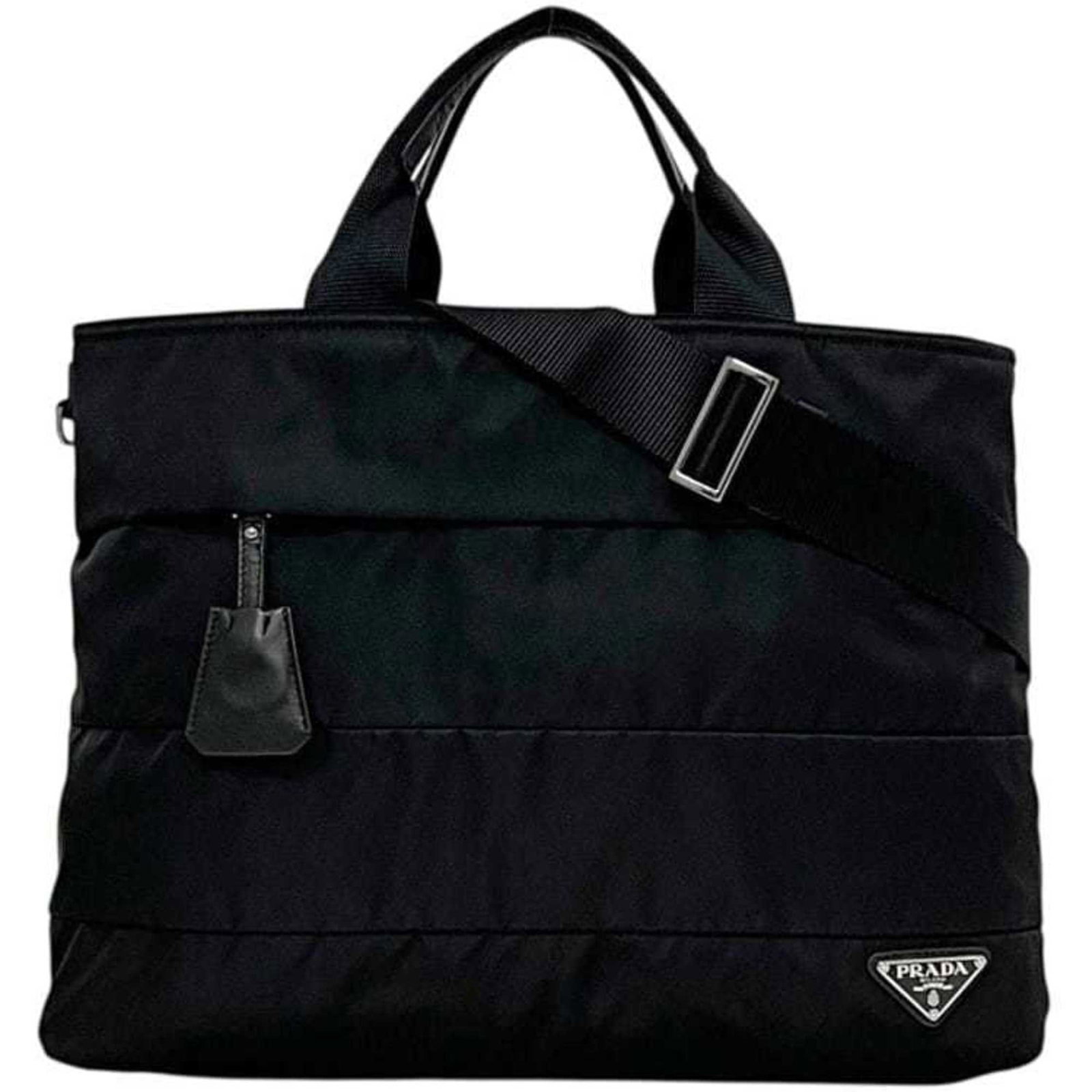 Prada Tote Bag - Nylon and Leather: Prada Tote Bag - Nylon and Leather A sleek and sophisticated Prada tote bag, crafted from durable nylon and supple leather, boasts a timeless black Nero hue that exudes understated elegance. With its