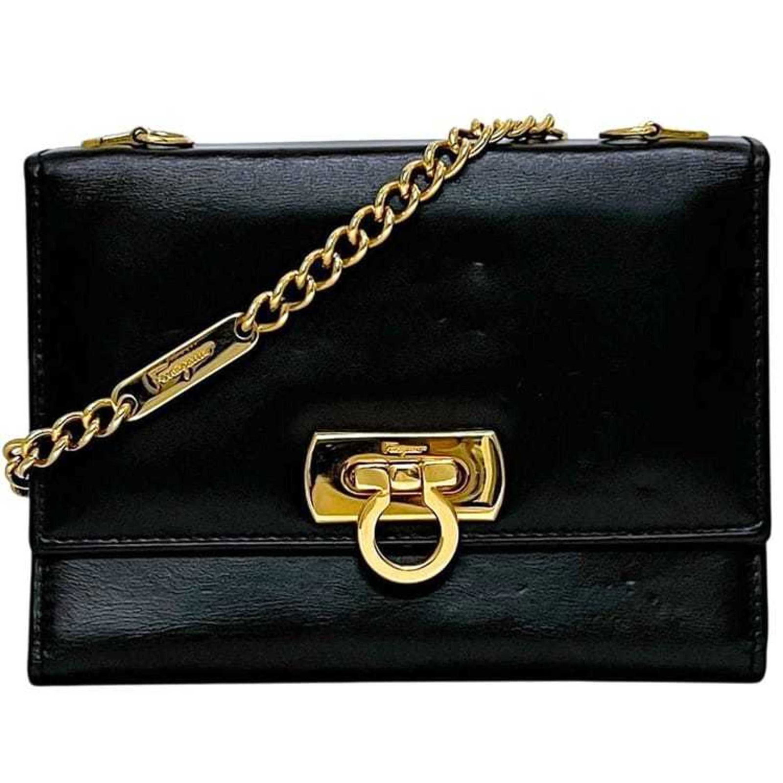 Salvatore Ferragamo Leather Chain Shoulder Wallet: Salvatore Ferragamo Leather Chain Shoulder Wallet A sleek and sophisticated Salvatore Ferragamo leather chain shoulder wallet, perfect for adding an air of elegance to any outfit. With its classic des