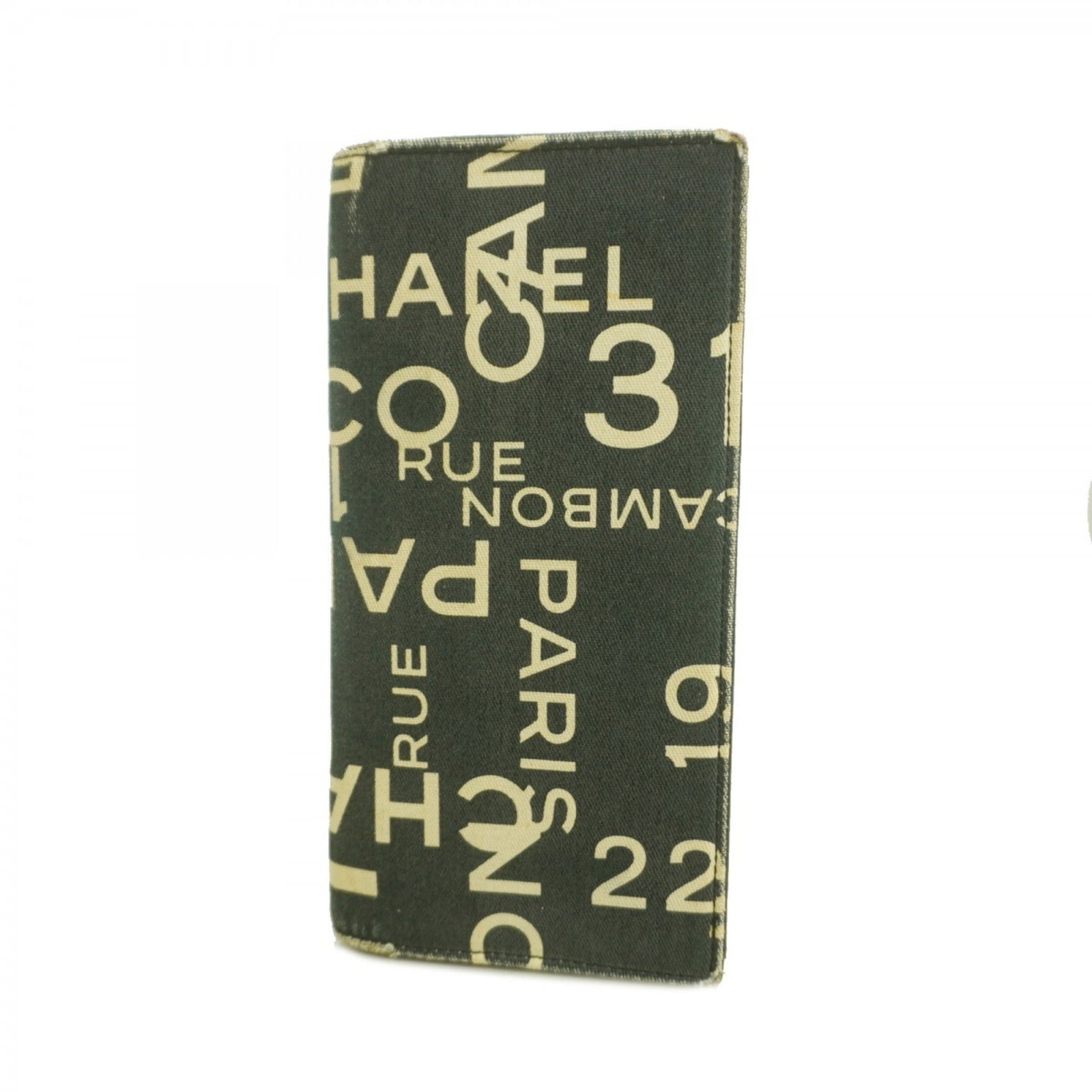 Chanel Bi-Fold Canvas Wallet: Chanel Bi-Fold Canvas Wallet A timeless piece from the iconic Chanel brand, this bi-fold canvas wallet boasts classic design and versatility with its spacious interior and sleek black finish. With its