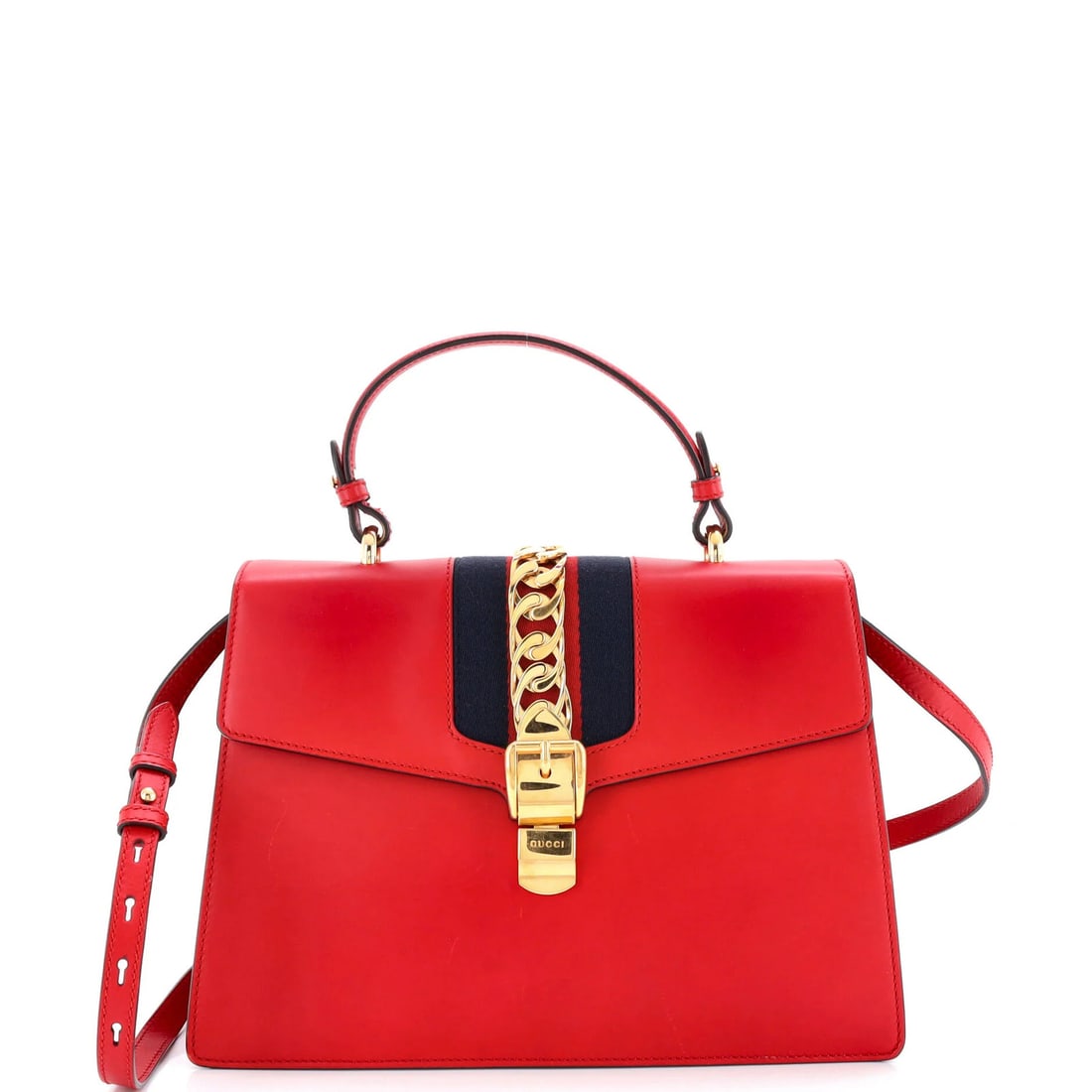 Gucci Sylvie Top-Handle Bag in Medium Leather: Gucci Sylvie Top-Handle Bag in Medium Leather Experience the iconic style of Gucci's Sylvie Top-Handle Bag, boasting sleek red leather and gold hardware that adds a touch of luxury to any outfit.