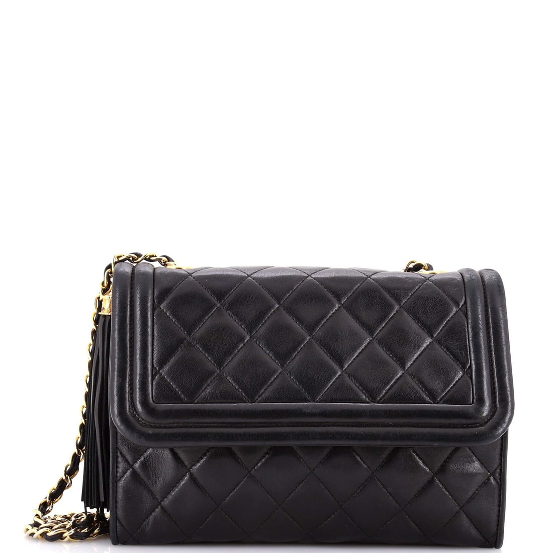 Chanel Vintage Mini Tassel Flap Quilted Lambskin Bag: Chanel Vintage Mini Tassel Flap Quilted Lambskin Bag A true vintage gem, this Chanel mini tassel flap quilted lambskin bag exudes timeless elegance with its classic design and luxurious quilted leathe