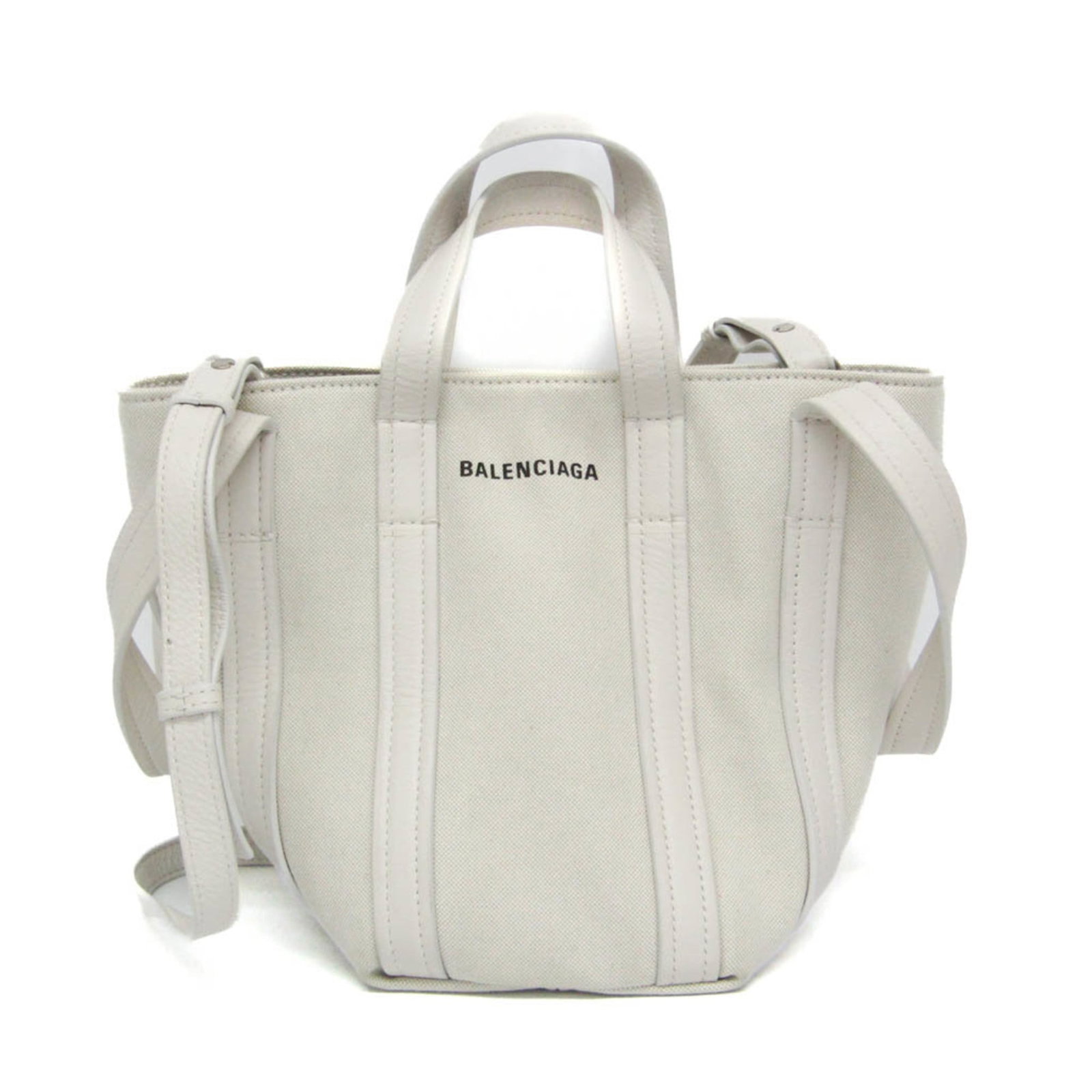 Balenciaga Leather Shoulder Tote Bag: Balenciaga Leather Shoulder Tote Bag Elevate your everyday style with the iconic Balenciaga Leather Shoulder Tote Bag, boasting a sleek off-white leather exterior and magnetic snap closure for effortl