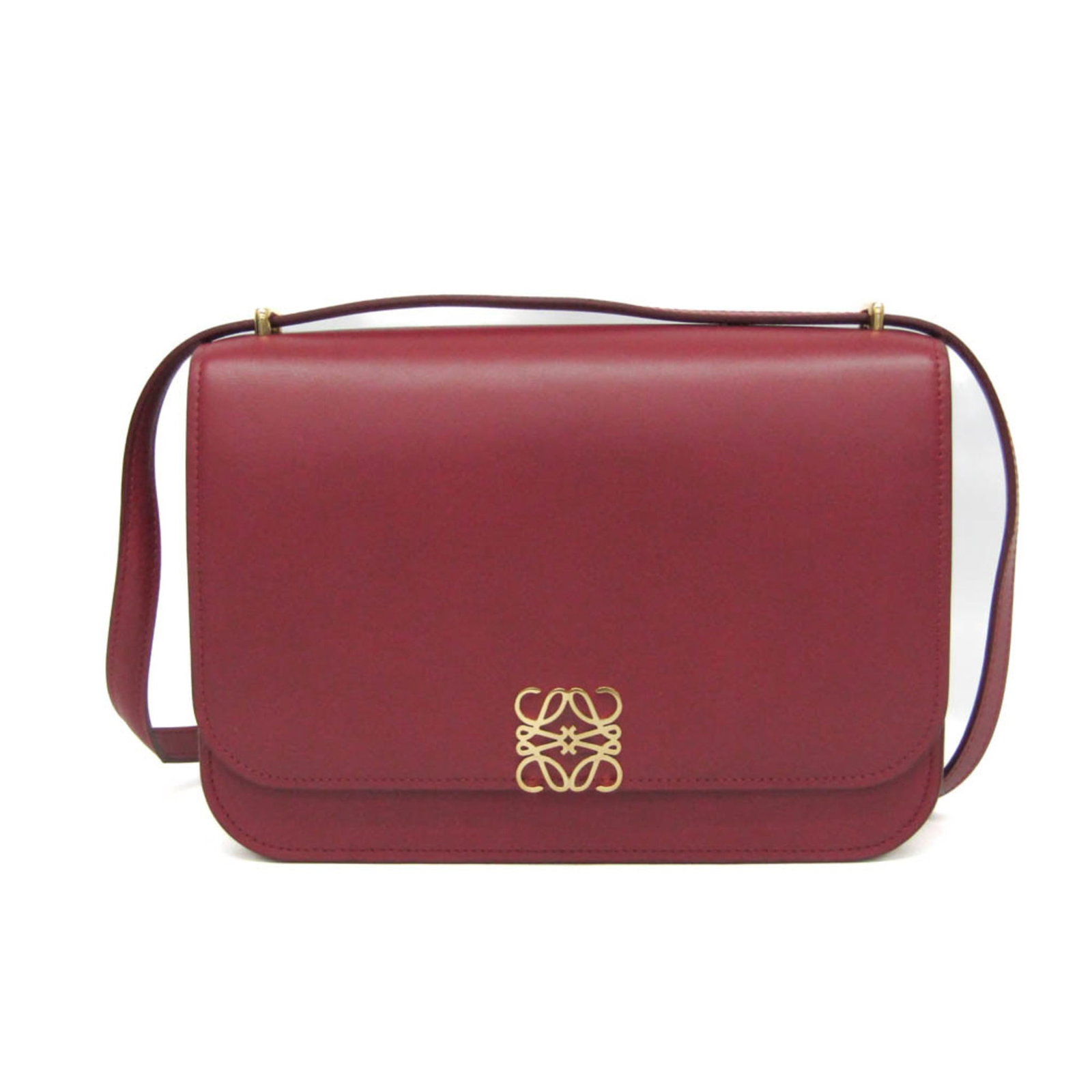 Loewe Leather Shoulder Bag: Loewe Leather Shoulder Bag Elevate your style with the iconic Loewe Leather Shoulder Bag, boasting sleek red leather and magnetic closure for effortless chic. The spacious interior features multiple p