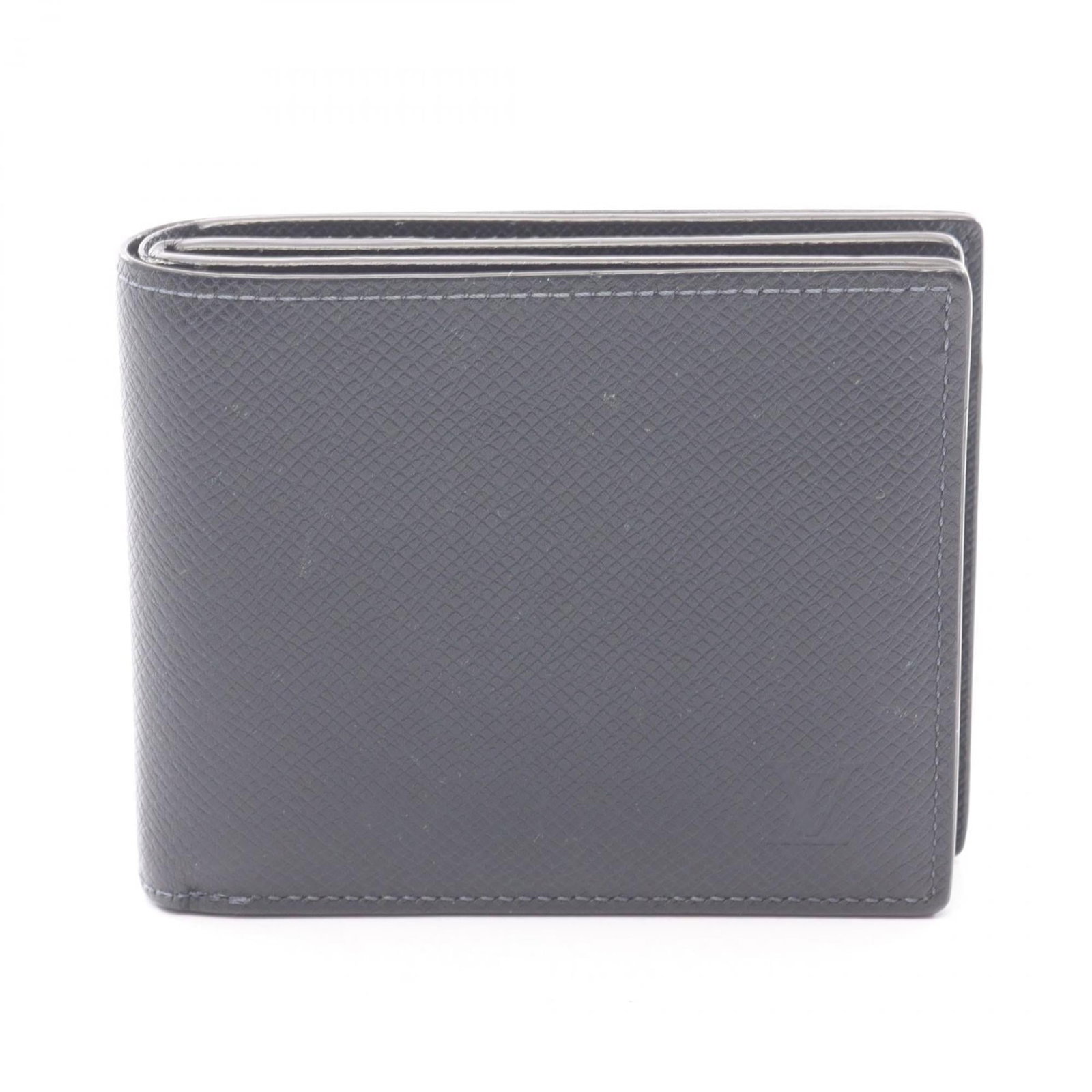 Louis Vuitton Bi-Fold Leather Wallet: Louis Vuitton Bi-Fold Leather Wallet A pre-owned Louis Vuitton bi-fold leather wallet in navy, boasting the iconic LV monogram pattern and premium leather construction. With its classic design and tim