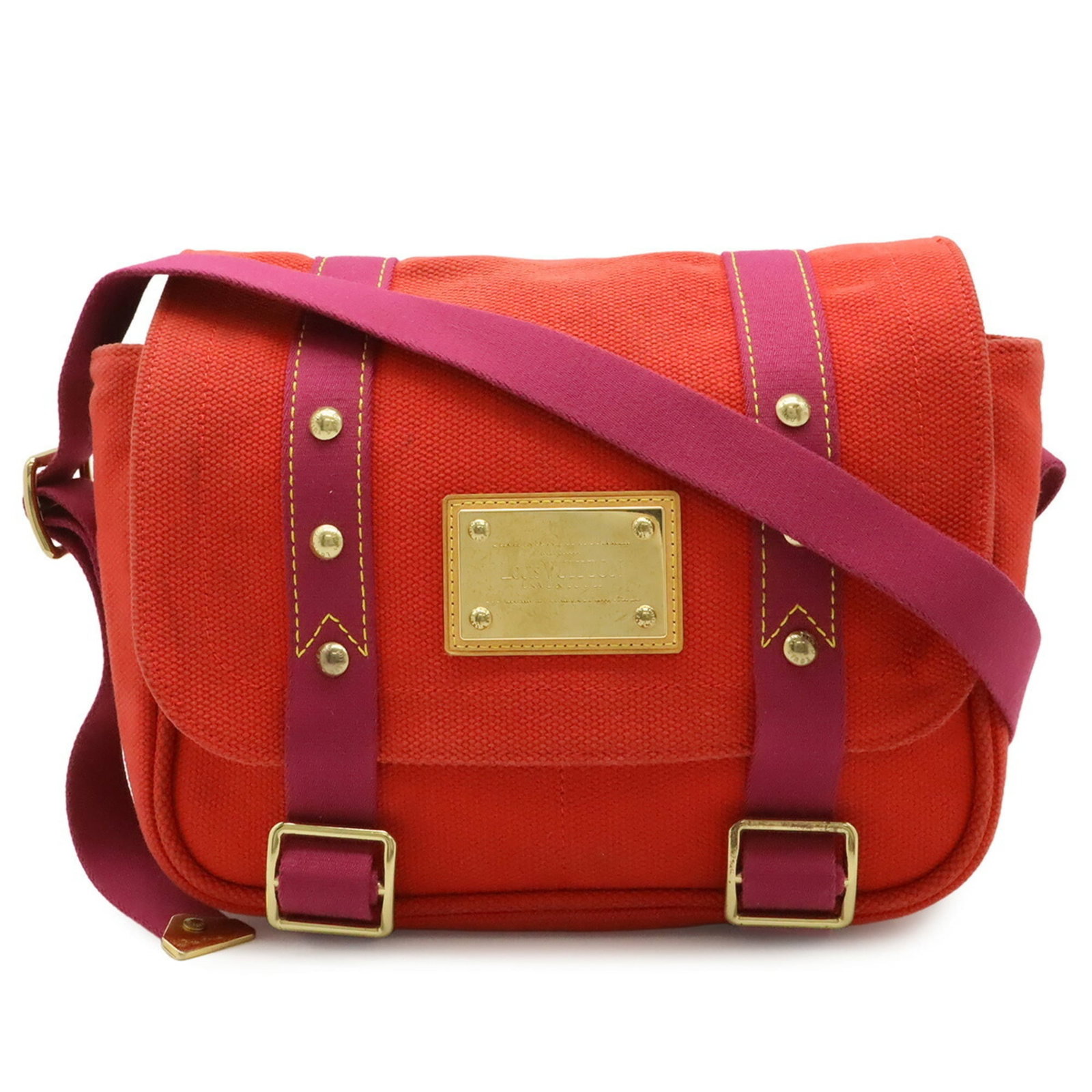 Louis Vuitton Canvas Shoulder Bag: Louis Vuitton Canvas Shoulder Bag A vibrant red canvas shoulder bag from the iconic Louis Vuitton brand, perfect for adding a pop of color to your daily routine. With its classic design and timeless s