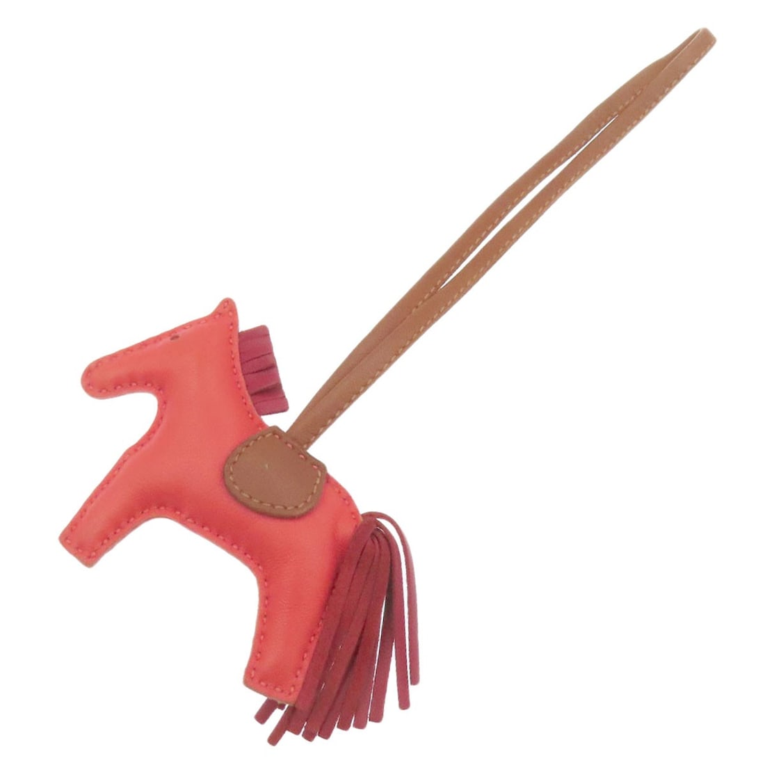 Miro HERMES Rodeo Charm PM key ring Anyo: Miro HERMES Rodeo Charm PM key ring Anyo A stunning Herm?s key ring, crafted from high-quality Anyo Miro material, adds a touch of French elegance to any accessory. The vibrant red and brown hues evok